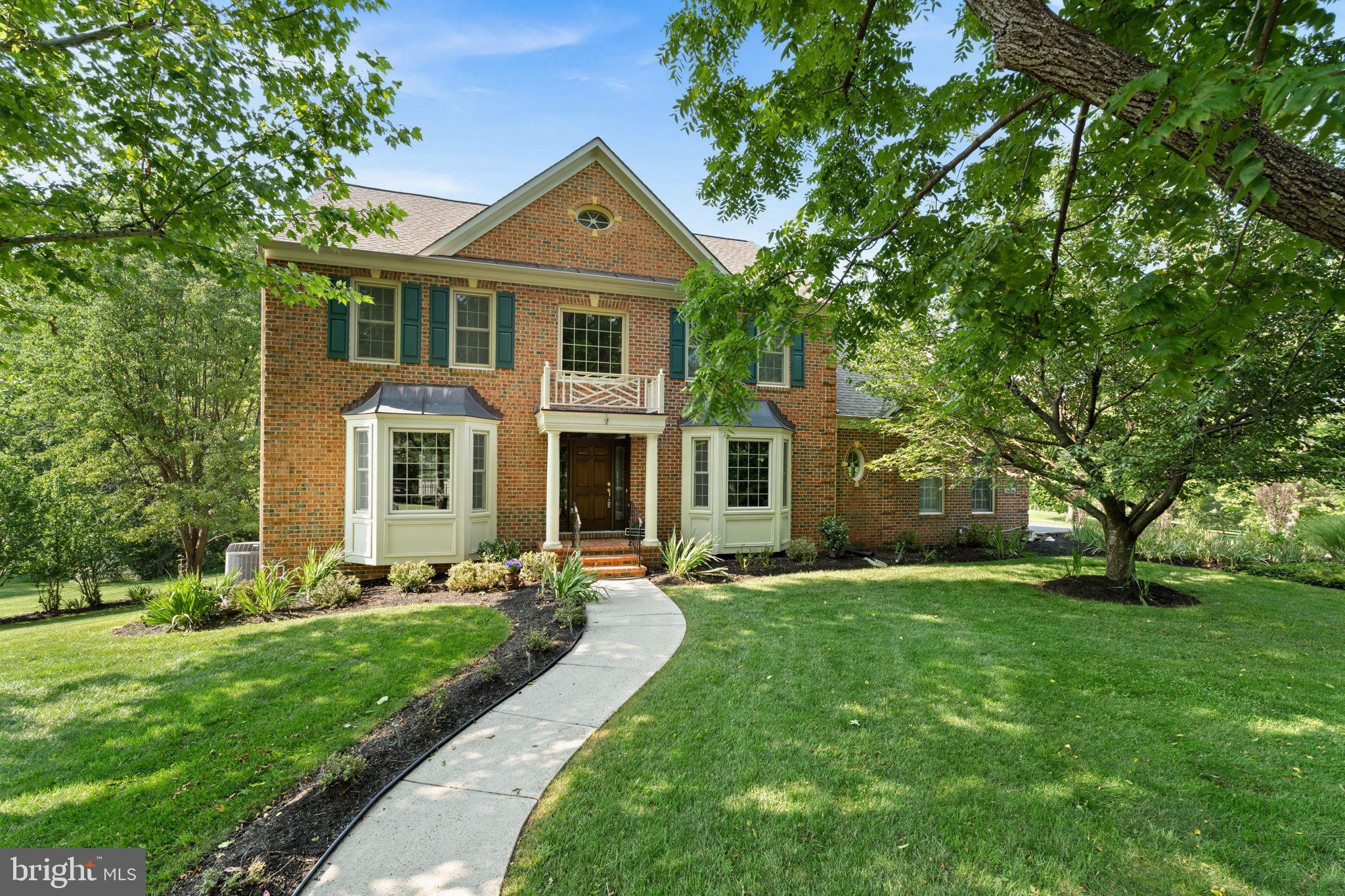Welcome to Shelter Lakes—where privacy, space, and timeless craftsmanship from Quaker Homes come together on 5 beautiful private acres full of mature, majestic trees and landscaping.
Proudly offered by the original owner, this freshly painted stately brick residence delivers the perfect blend of elegance and comfort. A winding walkway leads to a grand entrance, setting the stage for the exceptional features found throughout. Inside, rich beuatifully maintained hardwood floors, generous room sizes, and quality construction create a warm and inviting atmosphere. The heart of the home is the dramatic family room showcasing a stunning floor-to-ceiling stone fireplace, complemented by an expansive sunroom filled with natural light and serene views of the surrounding property.  Enjoy the rare opportunity to own 5 private acres in sought-after Shelter Lakes. Mature, wooded lot with peaceful surroundings create a true retreat while remaining convenient to shopping, dining, commuter routes, and top local amenities. LOW LOW HOA! Four large bedrooms with a bump out sunroom off the kitchen.
Additionally, a side load 3-car garage, a large easy-care wrap deck and covered gazebo and circle driveway! A gazebo made for relaxing summer dinners and enough space to finally breathe—all just minutes from everything Haymarket and Gainesville, 66, 15 and 50!
 Experience the space, privacy, and lifestyle you've been searching for. 
Open House scheduled for Saturday 1:00-3:00.