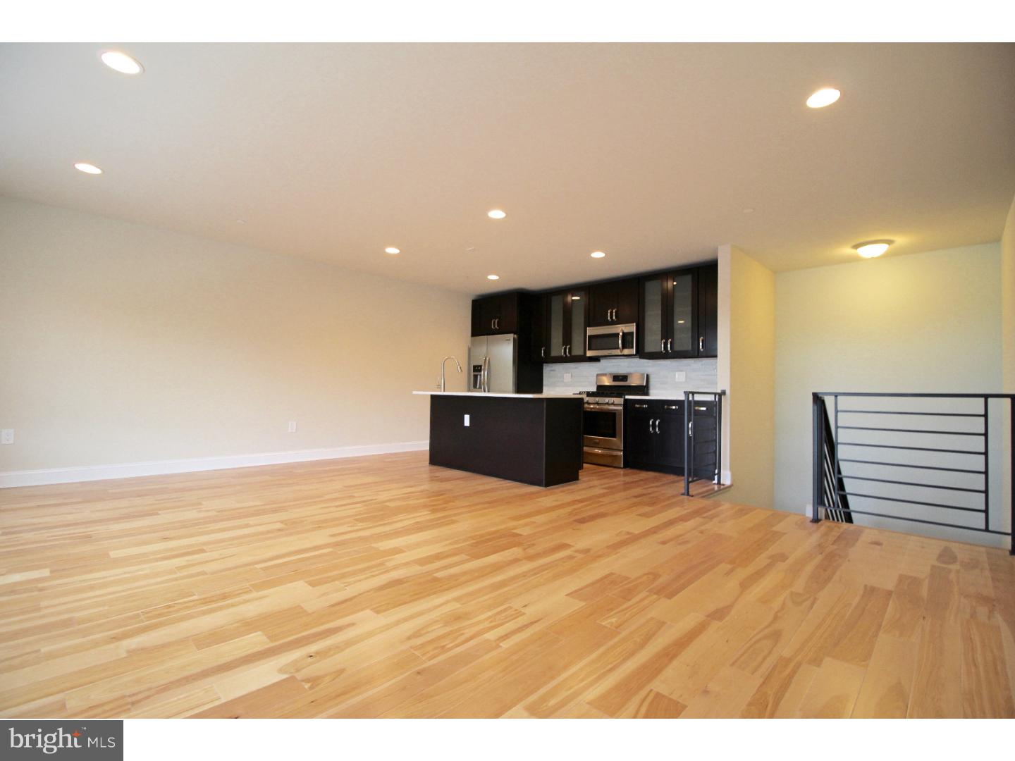 Be the first to live in this BRAND NEW Fishtown tri-level Condominium unit. Newly constructed, well built and laid out. Everything here is brand new from plumbing and electric, down to the high end luxury finishes.  The first level of the Condo features a nicely sized bedroom with a large closet, and full bathroom. The upstairs (3rd level ) consists of the open floor plan living room and chef ready kitchen. This room is perfect for entertaining and relaxing, large windows facing east allow ample natural light to fill the unit, and overlooks Penn Treaty Park and the Delaware River. The Kitchen features a Frigidaire Gallery stainless steel appliance package, which includes a French door refrigerator, dishwasher, and 5 burner gas stove. Excellent color scheme with dark brown and frosted glass cabinetry, glass tiled backsplash, and complimenting granite counters and island. The Island provides extra prep space and seating. There is also an Airphone intercom system with a camera feed on this level. Throughout the Condo there is custom steel railing.  Continue down to the lower level which consists of a large bedroom with en-suite bathroom, and laundry room with brand new front loading full sized washer and dryer. The en-suite bathroom features a glass enclosed shower with a granite bench.  This is a superb location for Fishtown and commuters. Very easy access to I95 and Delaware Blvd. Walking distance to numerous renown cafe's, eateries, pubs, and restaurants. Directly across the street from lovely Penn Treaty park and the Delaware river.