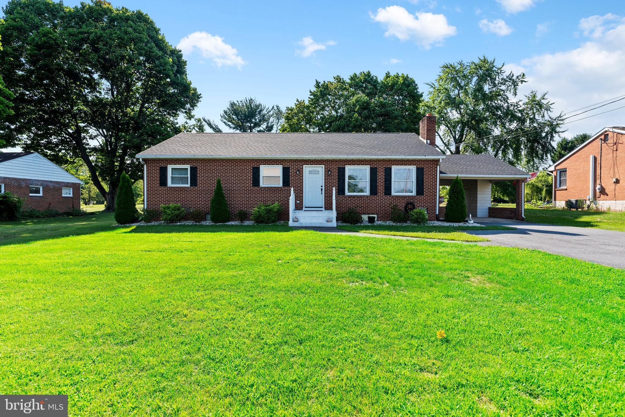 This is the home you have waited for... this brick one-story home is an efficient, low maintenance home with charm and curb appeal.   Hardwood floors throughout have been brought back to their natural beauty and the archways remain as a nod to the styles of the 1950's .   The wood burning fireplace in the living room will create a cozy spot to relax.  An open kitchen comes with a full matching set of stainless appliances (including 1refrigerator), granite countertops, ceramic tile flooring, a garbage disposal, tile back splash and recessed lighting.   You will find this updated bathroom to be a dream with the huge walk in rain shower.  All three bedrooms are comfortable in size and have ample closet space.   The mechanicals have all been installed within the last 5 years and include a new efficient HVAC system, a water filtration and softener system, a ManaBlock with a complete PEX system replacement, an on-demand tankless natural gas water heater,  an entire basement waterproofing system,  and a pvc sewer system replacement including a sewer lateral replacement from the home to the main!!!!
Outside the large maintenance free deck leads out to a spacious level yard and the pole barn complete with concrete slab floor, electric subpanel and workshop bench.  A carport this wide can accommodate more than just a car plus provide extra storage for garden equipment or that extra bulky stuff in the side storage area.