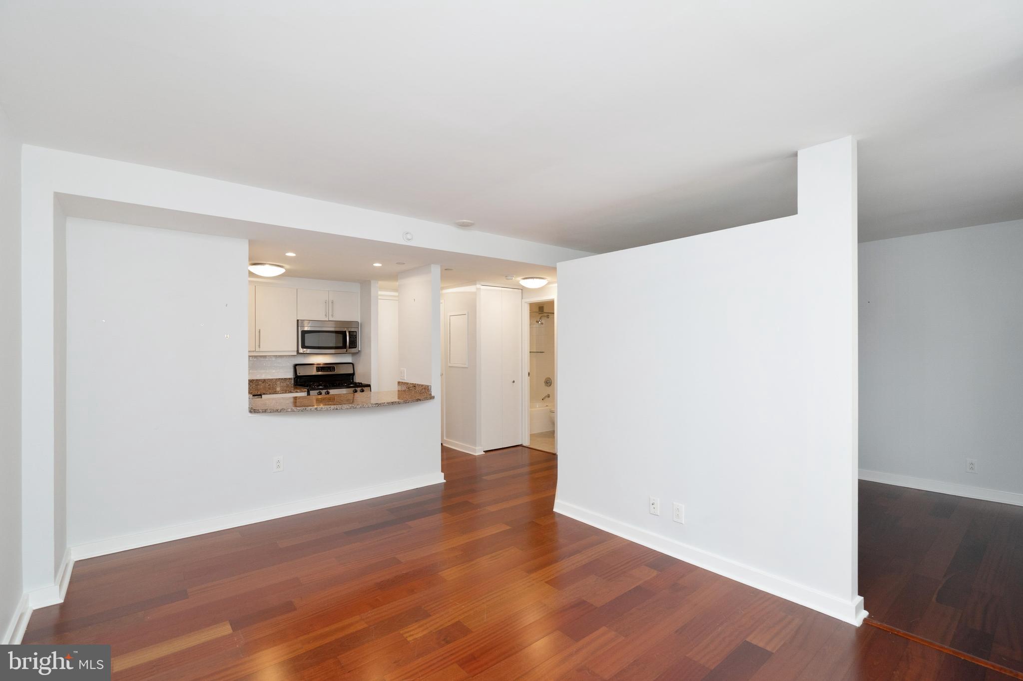 Junior one bedroom residence at Parc Rittenhouse featuring high-end finishes and a well thought-out floorplan. The home offers a modern kitchen with flat panel cabinetry, stainless steel appliances, a tile floor and granite countertops. The great room provides ample space for both dining and living areas and has a wonderful city skyline view. The bedroom also has a city skyline view, as well as a wall closet. The full hall bathroom is appointed in marble. Additional home highlights include great closet space, a combo washer/dryer and Brazilian cherry hardwood floors. Residents of Parc Rittenhouse enjoy world class amenities and services including a 24 hour doorman; an amenities suite that includes a brand new state-of-the-art fitness center and resident lounge with pantry; media room; outdoor rooftop pool club with a large pool deck, full size pool, kids pool and hot tub; garage parking below the building for an additional fee; and two amazing restaurants on the ground floor, Stephen Starr’s Parc and Via Locusta.