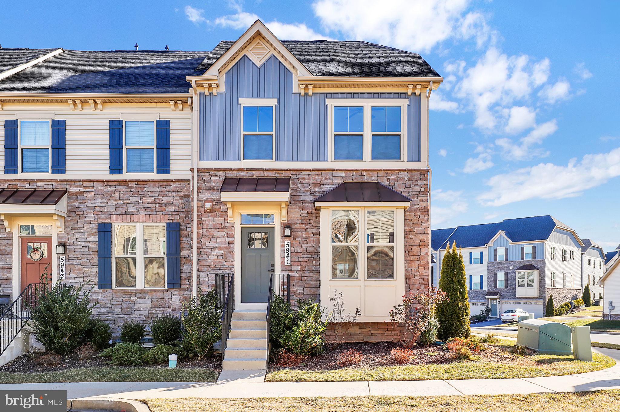 When luxury meets everyday convenience, this exceptional END-UNIT townhome delivers an elevated lifestyle in every detail. Built in 2021 and showcasing striking stone and shake siding, this beautifully designed residence offers approximately 2,120  square feet of finished living space with a bright, open-concept layout, 4 spacious bedrooms, and 3.5 baths. A fully finished WALK-OUT basement and a generous two-car attached garage add both flexibility and function. >>>Ideally located next to the community clubhouse, pool, and playgrounds. Set within WALKABLE distance to local elementary, middle, and high schools, the home blends comfort with prime convenience. Enjoy the ease of stepping outside to neighborhood amenities, scenic surroundings, and everyday essentials, all within comfortable reach. >>>Inside, elegant front box windows, custom top-down/bottom-up cellular blinds, and luxury plank flooring create a refined, modern feel throughout. Recessed lighting and stylish ceiling fan fixtures enhance the ambiance and adds a distinctive touch to the main living area. >>>The primary suite is a true retreat, featuring a tray ceiling and a spacious walk-in closet, while a private in-law suite offers additional comfort and versatility. The well-designed laundry area adds everyday ease. At the heart of the home, the stunning kitchen impresses with an oversized island, bar seating, deep sink, Energy Star stainless steel appliances, gas range, and a French-door pantry - perfect for both entertaining and daily living. >>>With a total of four parking spaces, including garage and driveway, convenience is unmatched. Out back, unwind with peaceful views of a lush, open meadow - an idyllic and private backdrop perfect for relaxing evenings or effortless outdoor entertaining. >>>Photos have been virtually staged.