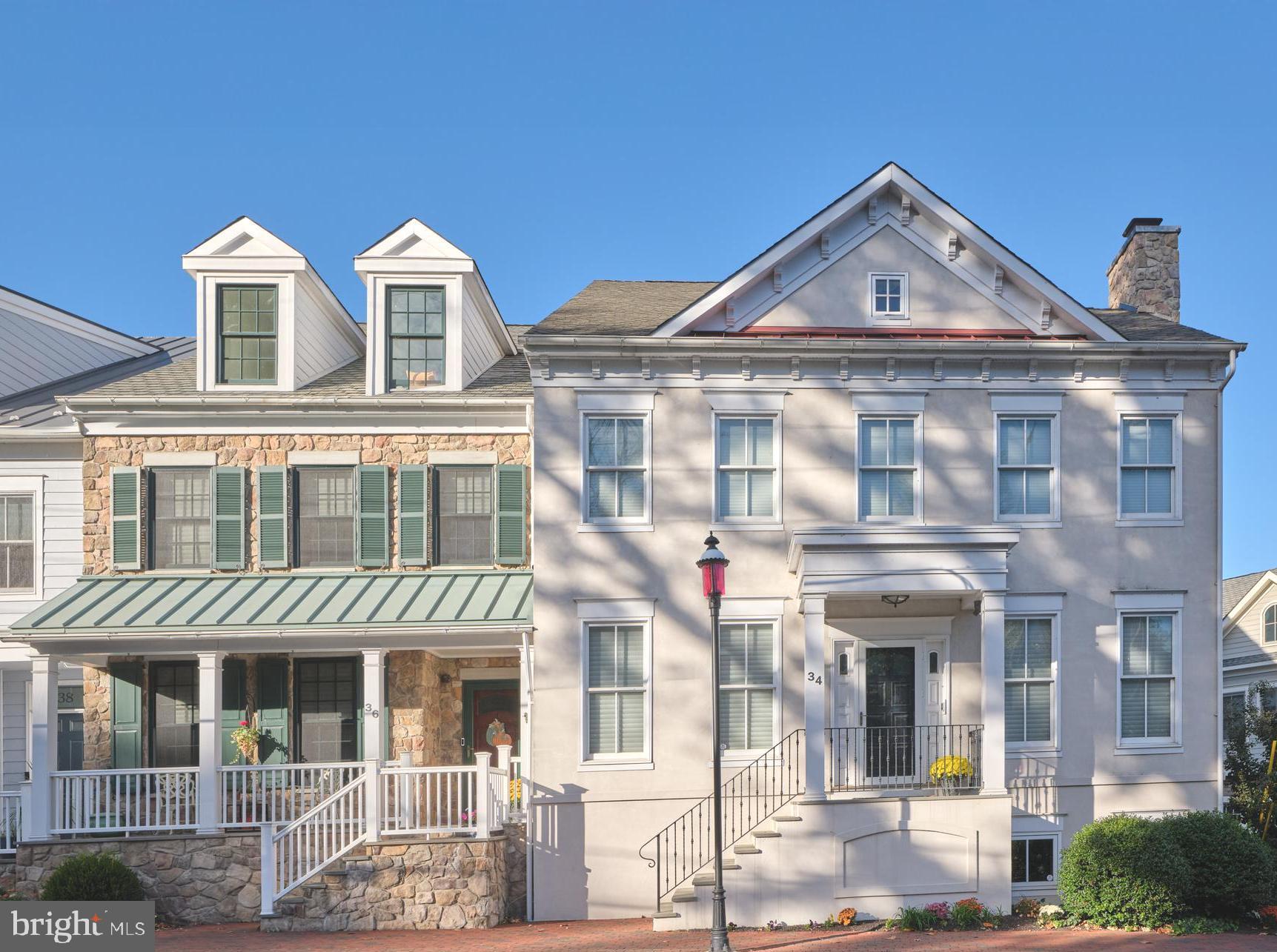 Perfectly situated in the dynamic heart of downtown New Hope, PA, this elegantly appointed townhome combines refined craftsmanship with contemporary convenience. Every intricacy of this meticulously maintained residence has been artfully enhanced, resulting in a home that exudes elegance, intimacy, and functionality.  Inside, discover beautifully proportioned living spaces highlighted by custom installed solid mahogany doors, lending a sense of warmth and sophistication throughout. The living area reveals a stone adorned gas fireplace and stylish built-ins. The layout gracefully flows into the gourmet kitchen, showcasing a central island with countertop seating, a Wolf range set against a delicate Italian tiled backsplash, bespoke cabinetry, and direct access to a welcoming rear deck. The upgraded powder room on the main level boasts custom millwork and a designer vanity, while the elevator interior has been redefined with striking onyx flooring—a subtle detail that amplifies everyday living. On the upper level, custom closets in both the primary and guest suites enhance organization, reflecting the home's commitment to luxury and thoughtful design. The third level provides additional space for another en-suite bedroom, office, music room, or whatever suits your lifestyle. The lower level offers ample room for your fitness equipment, while the garage's newly tiled flooring extends the sense of refinement to every inch of the property.  Two HVAC systems with multi-zone forced-air heating and central air, each supported by newly installed high-efficiency heat pumps, ensure year-round comfort. For cooler seasons, propane-fueled fireplaces and emergency heat provide a cozy ambiance and reliable warmth. The home is serviced by public water, public sewer, propane, and electric, combining comfort with low-maintenance practicality.
This is elegant townhome living at its finest, a rare offering located just a stone's throw away from the beating pulse of the Bucks County Playhouse, boutique shopping, unique art galleries, organic markets and a plethora of award-winning bars and restaurants. New Hope continues to be recognized as one of "America's Best Small Towns", and for good reason. Experience the vitality of New Hope’s historic downtown whilst retreating to a residence marked by exceptional craftsmanship, opulent finishes, and thoughtfully designed spaces. Small town, enormous opportunity!