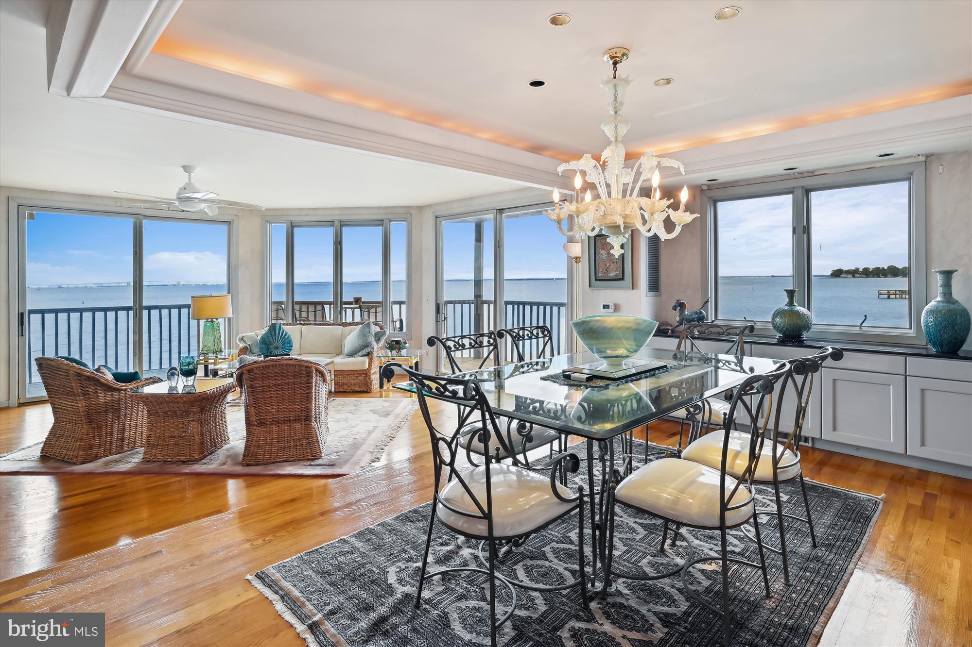 Experience unparalleled luxury and breathtaking panoramic water views of Chesapeake Bay in this exquisite four-bedroom, 4.5-bathroom dream home. With a thoughtfully designed four-level layout serviced by a private elevator, this rare property offers exceptional vistas and elegant living spaces on every floor.
The first-floor family room opens to a sandy beach and stunning water views, while the second floor features a sophisticated living room with a fireplace, a formal dining room, and a spacious eat-in kitchen adorned with a bay window and skylight. The third-floor primary suite is a serene retreat, showcasing sweeping Bay views.
Nestled in an exclusive community, rarely available on the market, residents enjoy front-row seats to awe-inspiring sunrises, the gentle lapping of waves, and refreshing Bay breezes. Exclusive amenities include a private sandy beach, a full-sized Bay-side pool, tennis and pickleball courts, an oyster-shell walking path, fishing piers, and a deep-water marina with direct access to the Bay. For dining and entertainment, an upscale on-site restaurant and Tiki Bar enhance the resort-style living experience.
Watch private yachts, Navy vessels, sailboat regattas, and the Blue Angels' annual May performances. Situated at the mouth of the Severn River where it meets the Chesapeake Bay, this exceptional home offers unmatched access to Annapolis’ historic charm, the U.S. Naval Academy, St. John’s College, premier dining, shopping, live theater, and transportation hubs.
Indulge in a lifestyle of elegance, comfort, and the natural beauty of Chesapeake Bay in this truly extraordinary property.