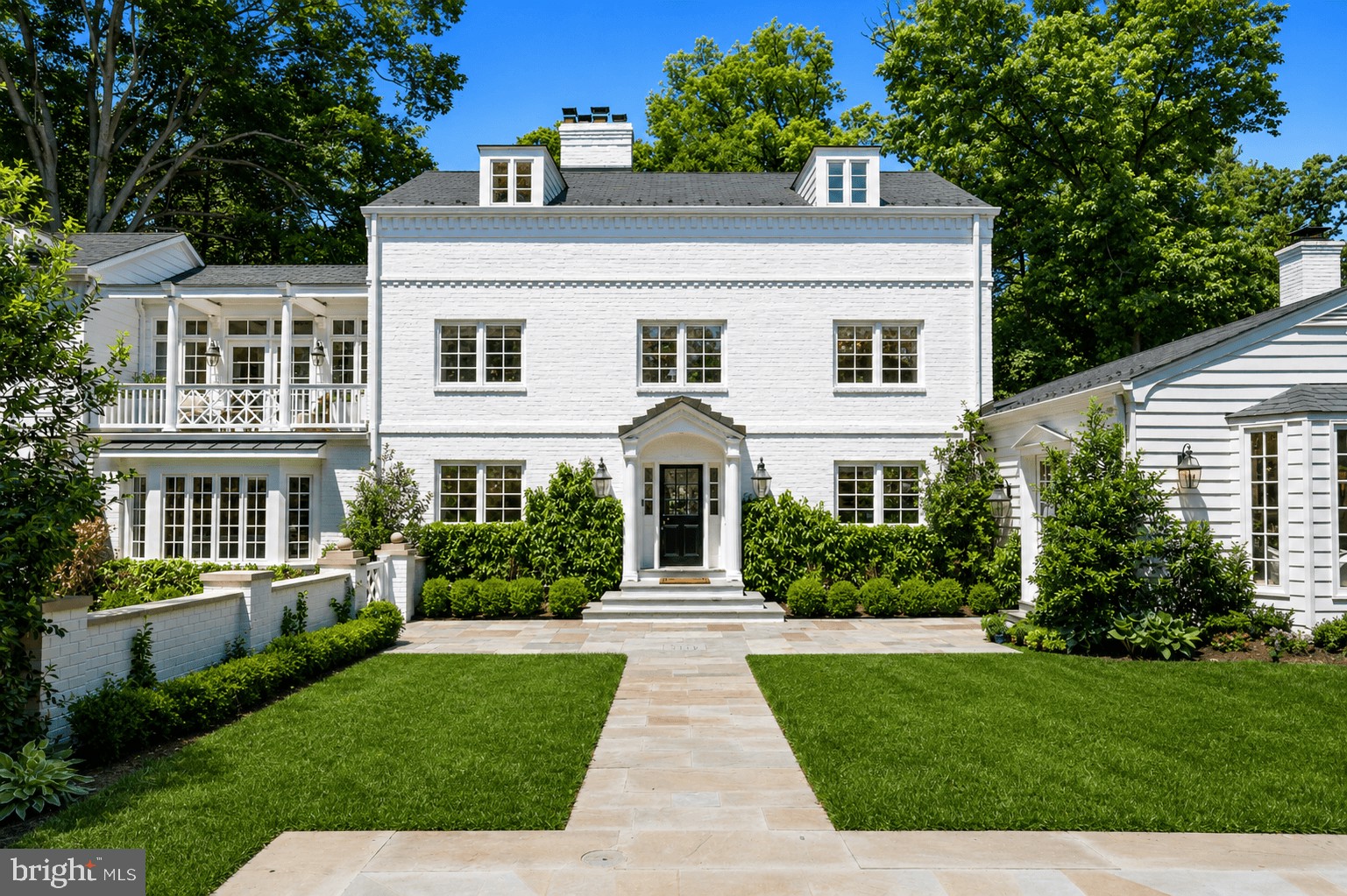 Nestled on a rare and extraordinarily private half-acre lot directly across from Battery Kemble Park, this one-of-a-kind five-bedroom estate offers a truly exceptional lifestyle in the heart of Washington, D.C. Enchanting, sophisticated, and surrounded by lush mature landscaping, the property feels like a secluded resort while remaining moments from the city’s finest amenities.

Designed for both grand-scale entertaining and comfortable everyday living, the residence features an elegant floor plan with an expansive living room, gracious formal spaces, and seamless indoor-outdoor flow. The resort-inspired grounds are unparalleled, highlighted by a stunning swimming pool, exceptional outdoor kitchen, and multiple terraces and gathering areas that create an extraordinary setting for entertaining and relaxation.

The second-floor primary suite serves as a private retreat, complete with a fireplace, dedicated office, and luxurious bath. An additional guest bedroom is located on the second level, while the third floor offers three more spacious bedrooms. 

An attached two-car garage provides comfort and convenience year-round.

A rare offering of remarkable privacy, sophisticated design, and world-class outdoor living in one of Washington’s most coveted settings.