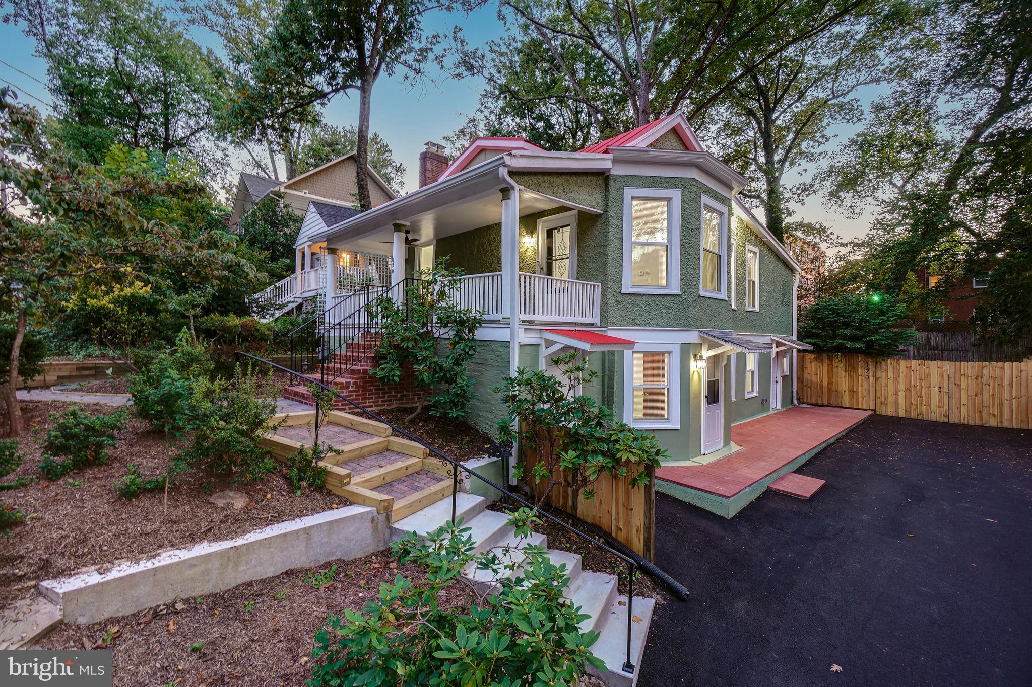 Welcome to this renovated bungalow with a delightful front porch, taking in tree-top views on one of vibrant Takoma Park's friendliest blocks! This incredible home offers superb architectural details, wood-grain porcelain tile flooring, Kichler ceiling fans, intricate crown molding, beautifully renovated bathrooms, two separate gorgeous quartz kitchens, all new windows, and a remarkable perch and porch! Enter via the light-filled living room with recessed lighting and “wood style” porcelain tile flooring. The living room opens to the sun-drenched dining room with a drum chandelier. The brand-new open chef’s kitchen offers a Samsung stainless steel appliance suite, gas cooking, exquisite quartz counters, gorgeous floor to ceiling oak cabinetry, a breakfast bar with backyard views, and access to the rear deck.  The main level is complete with two bedrooms, and two renovated spa bathrooms, including the primary bedroom suite with a designer ceiling fan, a mirrored wall closet, and a luxurious private bathroom. Off the dining room are fixed stairs to the attic.

Downstairs offers a bright family room, a versatile bedroom / playroom with an exterior exit, a fourth bedroom, a renovated bathroom, and a 2nd quartz kitchen with access to the back deck and yard. This thoughtfully designed level could be utilized as an in-law suite / or a separate living space. 
The exterior includes a fenced yard with privacy fencing, a large deck with composite decking boards, a side brick patio, a covered front porch, and delightful brick paver pathways. This property is complete with a new driveway that can tandem park multiple cars (the backyard gate opens to accommodate additional parking).  Conveniently located on a quiet close-knit street with frequent neighborhood gatherings near the Takoma Park Community Center and Piney Branch Elementary School! 

The perfect location: close to Sligo Creek Park and the Takoma Park Library and Community Center. Just 0.7 miles to the Takoma Park Metro Station! Enjoy living in eclectic Takoma Park; the location offers all the allure and convenience of this very special area.  Relish the warm sense of community as well as ready access to shopping, restaurants, the farmer’s market, and entertainment in both Takoma Park and wonderful, vibrant downtown Silver Spring. See you there!