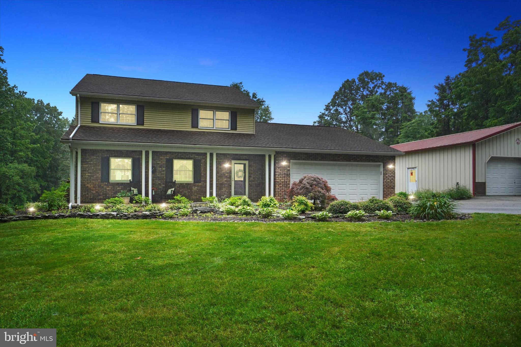 Enjoy this serene setting of lush lawn and wooded area featuring two ponds  and waterfall , plentiful fish in one   of the ponds .  Sunsetter awning over the patio and beautiful amazing setting.  All the windows in the rear of this are Anderson Replacement windows and remainder from new are Anderson also. Door of the family room onto the patio is original. Exterior woodstove can heat the house or there is also a Heat pump on the property for heat and cooling. Kitchen Cabinetry Refaced.  New Roof 2009. Don't miss the opportunity to own this amazing property!