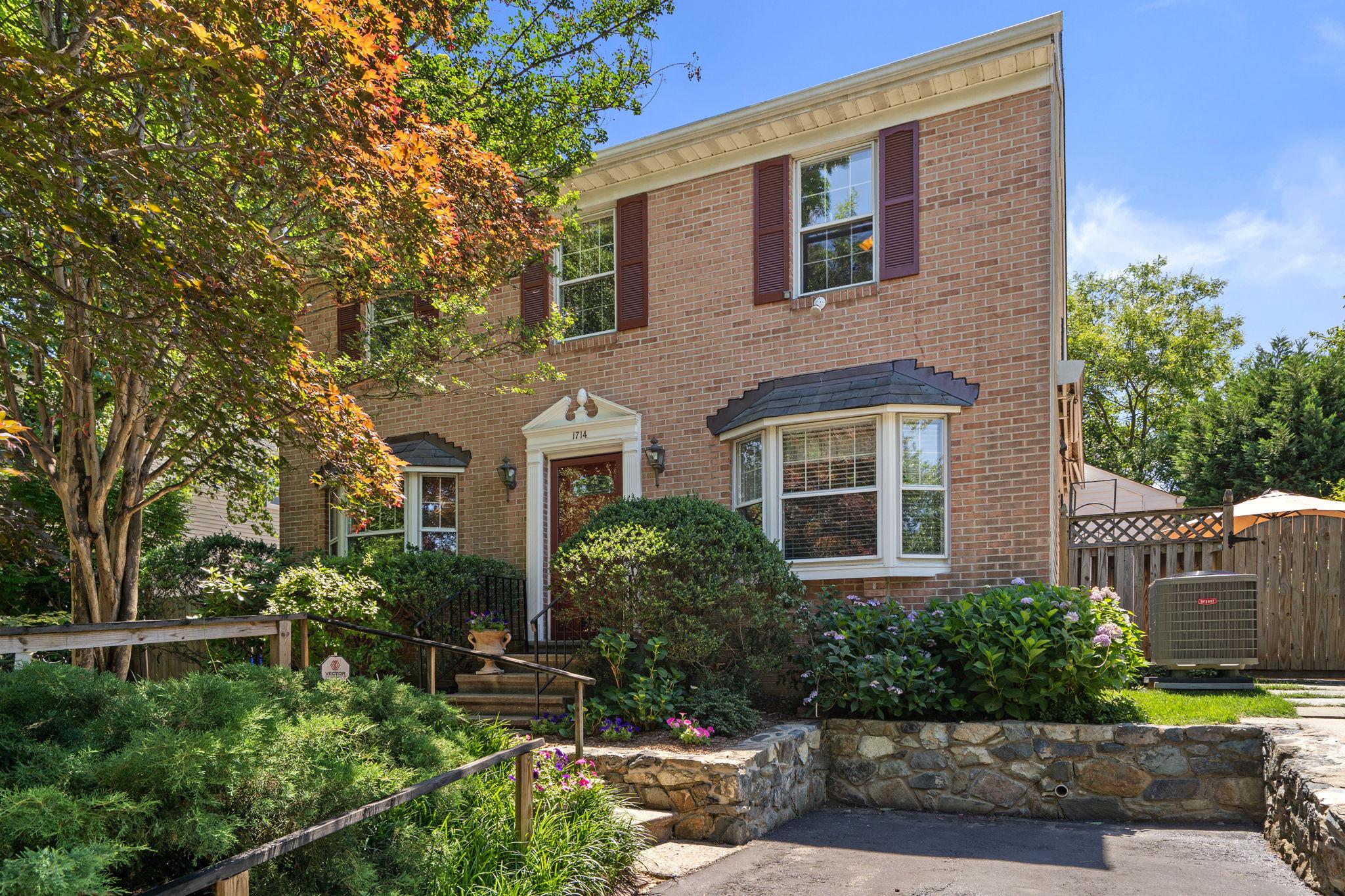 Welcome to 1714 Luzerne Avenue, a beautifully maintained residence nestled in Woodside Park. Pride of ownership is evident throughout this meticulously cared-for home, offering over 2,900 square feet of thoughtfully designed living space with 4 bedrooms and 3.5 bathrooms. Upon arrival, you will be greeted by lush, mature landscaping that creates an inviting first impression. Inside, the sun-filled main level features hardwood floors, generous room sizes, and a versatile floor plan designed for both comfortable everyday living and entertaining. The spacious living and dining rooms are anchored by a gas fireplace, while a bonus front den with custom built-ins provides the perfect space for a home office, library, or additional gathering area. The well-appointed kitchen is a chef's dream, featuring upgraded granite countertops, two sinks, two dishwashers, a gas range, pantry storage, and an eat-in area. Adjacent to the kitchen an expansive family room addition offers abundant living space and access to the private backyard through French doors. A convenient powder room with pocket doors completes the main level. Upstairs, you will find three generously sized bedrooms, including a spacious owner's suite two closets and private en-suite bath. Two additional bedrooms, plus a small room ideal for a nursery and/or office space, share a full hall bathroom. The upper-level features brand-new carpeting throughout and fresh paint throughout most of the spaces. The fully finished lower level offers exceptional flexibility, functioning as a private living suite complete with a family room, wet bar, bedroom with an egress window, full bathroom with walk-in shower, laundry room, and direct walk-out access to the backyard. Outdoor living is equally impressive. Enjoy your own private backyard oasis featuring mature landscaping, a tranquil side patio right off the kitchen, a covered patio perfect for al fresco dining, and four storage sheds, all with electricity. Whether relaxing, gardening, or entertaining, this outdoor retreat offers so many possibilities. Notable improvements include a new roof (2026), new upper-level carpeting (2026), fresh interior paint (2026), new stove (2026), HVAC system (2020), and family room addition (2000). Ideally located just minutes from Downtown Silver Spring, Metro access, parks, shopping, dining, and entertainment, this exceptional home offers the perfect blend of suburban tranquility and urban convenience. Enjoy easy access to major commuter routes while living in one of Silver Spring's most sought-after neighborhoods. This is a rare opportunity to own a truly special home in an outstanding location.