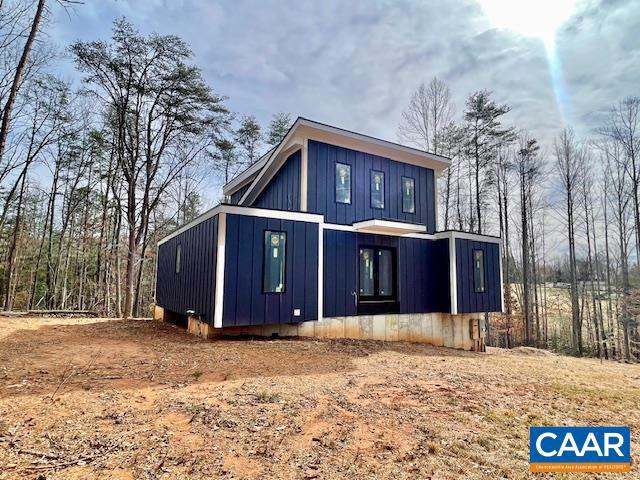 Fabulous contemporary home situated on a private 2-acre lot NEW BUILD is ready for insulation, drywall, and final touches! The home is currently under construction, all inspections have been completed to date.  Home is framed for one level living with Primary en-suite and 2 additional bedrooms on main level, an open floorplan with high ceilings, tons of windows to allow natural light to flow through and basement with  roughed-in wet bar, full bath, laundry area and plenty of storage space. FANASTIC location just off 33 in GC. PRIVATE 2 acres but just minutes to area amenities. The builder is wrapping up other projects, and offering the house as is, complete with full permits and approvals. Choose to work with the builder to finish the home or save money by completing it yourself. This house boasts the following features: 1000-gallon in-ground propane tank, Generator rough-in, Electric vehicle charging rough-in, Architectural-grade Pella windows and doors, Spacious deck with propane grill hookup, Full master suite with a bath and shower, 40-year torch-down rubber roofing.