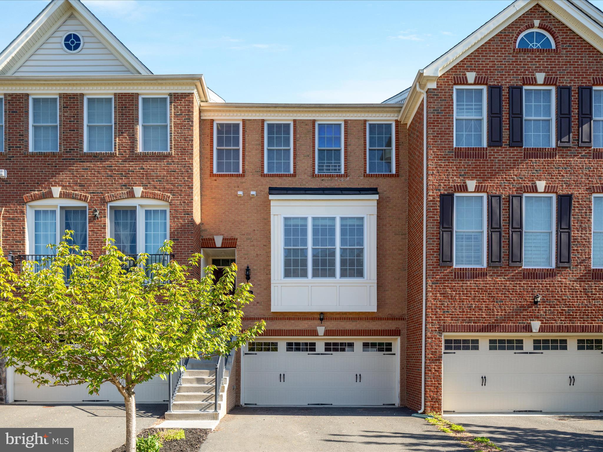 Welcome home to 302 Addivon Terrace!  This lovely brick townhome is perfectly located in the sought after community of Purcellville Green, walking distance to downtown Purcellville and convenient to everything.  This spacious home boasts beautiful millwork, fresh paint and flooring, a gourmet kitchen with all the upgrades, and a great layout.  A generous deck and fully fenced rear yard offer plenty of outdoor living space.  The welcoming entry opens to the beautiful formal living and dining areas, which connect to the gorgeous kitchen and an additional seating/dining space.  The upper level has three great bedrooms with volume ceilings, two full bathrooms, and a convenient laundry space.  The finished lower level provides a fantastic flex space, another full bathroom, and a walkout to the yard.  This one has it all!