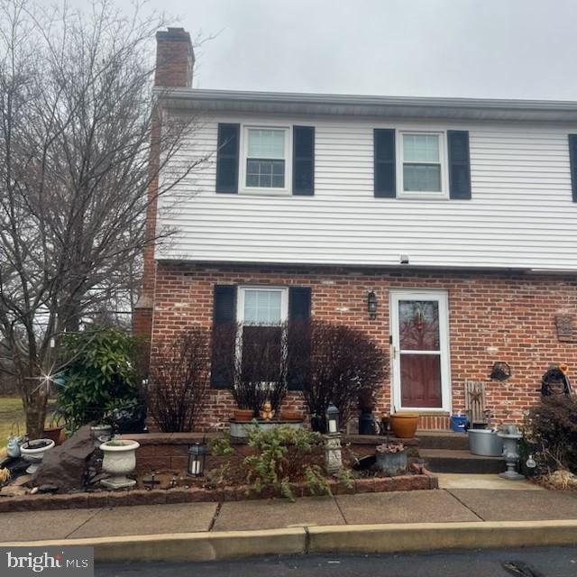 Welcome to this charming end unit townhome in Olde Colonial Greene. The home was built in 1985 and boasts a more modern appeal with partial brick front and white siding.  The property is the last townhome on the street and sides to open space.  The yard is lushly landscaped with raised beds and stone walls and rear and side yard are fenced. The property has been well maintained and upgraded during the sellers ownership.  New windows  and a side bay window with deep window sill were installed 2010.   A 35 year shingled roof was installed 10 years ago. Hardwood floors are found throughout the first floor, staircase and second level hallway.  The second level offers two large bedrooms  with the same square footage as the three bedroom model. A full attic could add a loft to the second bedroom.  The master bedroom provides double closets, ceiling fan, window shades and a full bath with walk-in shower. The second bedroom is spacious with vaulted ceiling , ceiling fan and large closet  The living room  boasts  gorgeous hardwood floors, bay window that could be a window seat, and lovely  wood burning fireplace with manel.  The dining room is in combination with Living room which flows nicely with the hardwood floors, dining table and ceiling fan. The Kitchen runs the full width of the townhome with lots of cabinets, second table option and sliding door with built-in blinds exists to the rear patio.  A 1/2 bath is offered with newer full sink and cabinetry, decorative mirror and lighting. Don't miss the full basement and all that storage,
The landscape is lush and perennial gardens in the front , back and side yard.  Fully fenced and perfect for family pets. Doggie door and kitty door ready to go.