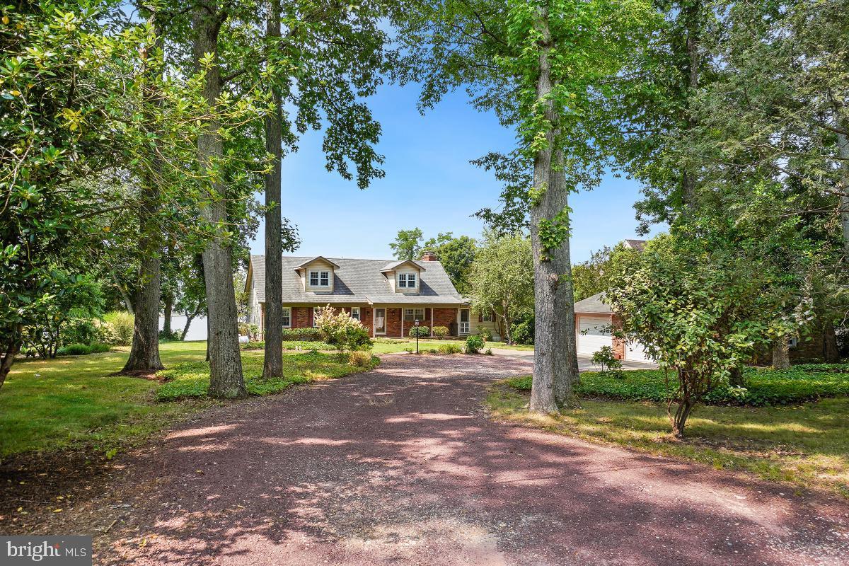 Welcome to 221 Cape Saint John Road, Annapolis.  This very charming private waterfront home has 120 feet of big water views on the South River and sits on a double lot with .62 of an acre of land.  The house is positioned back off the road and is well elevated above the water for the ultimate private retreat.  Enjoy the benefits of having public water and sewer. This home offers great privacy and  boundless possibilities. It must be seen to be fully appreciated. The private pier has 6-8 ft of MLW  with 2 boat lifts, a shed at the foot of the pier and room for several boats.   An oversized 2 car garage with plenty of parking in the driveway make this the ultimate family home. Very convenient location for shopping, restaurants and all commuter routes.