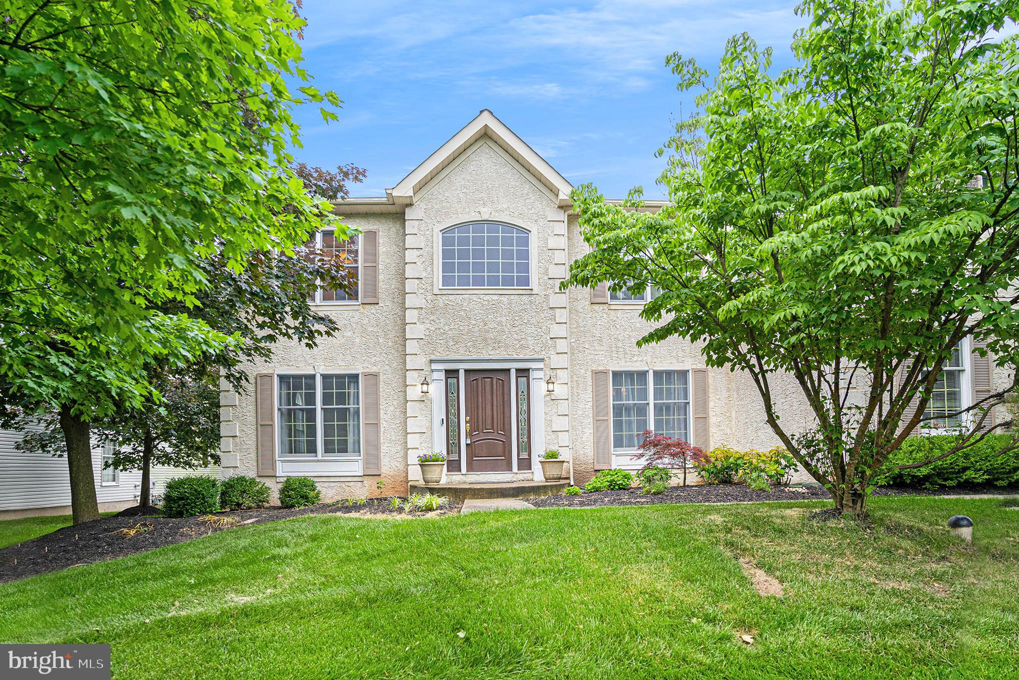 Country Club Living! Elegance meets charm in this incredible 4 bedroom, 2.5 bath, colonial-style home with over 4,200 square feet! Head inside to find a grand, 2-story entrance with stairs to the second level ahead, a formal living room to the left, and a formal dining room to the right. The bright formal living room boasts a bright picture window and a chair rail. Wainscoting and a trendy light fixture adorn the formal dining room. A grand living room boasts a 2-story ceiling with windows for incredible light, a gas fireplace for those chilly nights, and built-in storage space. This kitchen is every chef's dream - wood floors, stainless steel appliances, center island with storage, wine fridge, incredible cabinet and counter space, a breakfast nook with a skylight and access to the deck, built-in storage, coffee station, pantry, and a second staircase to upstairs! Need office space? The first floor also hosts a large office space with a view of the backyard. A half bath and the laundry room with a door to the outside complete this level. Head upstairs via the front or back stairs to find views of the living room below! The upstairs hall is open allowing natural light and a grand feeling. Double doors lead to an expansive master bedroom that easily holds a full king-size suite, 2 large walk-in closets, plus an attached sitting room that would make a great tv room, office, or even nursery! The master bath was designed with relaxing in mind - vanity with dual sinks and storage underneath, large corner jetted tub and a spacious glass stall shower. 3 airy guest bedrooms share a full hall bath which also has dual sinks with storage underneath, linen closet, and a tub/shower combo. Need more space? Head down to the finished basement with endless opportunities - play area, room for a pool table, media area - room for everyone! Plus did you see the storage space?! This space was in the process of being converted to a workout room and there is plenty of room to add another bathroom on this level. Outside you will find an expansive deck with a Michael Phelps Signature Deep Swim Spa with 39 jets which can be used for exercise, competitive swim practice, or rejuvenation in one of the 3 seating areas. This oversized lot enjoys views of the 11th hole of Blue Bell Country Club but positioned away from golf play. An attached 2-car garage completes this floor plan. Recent updates include new Roof (August 2020).  Tankless hot water heater (May2021), deck (November 2020), swim spa (June 2020) Amazing amenities include multiple swimming pools, fully equipped clubhouse with an exercise room/fitness center, tennis courts, pickleball courts, basketball courts, gated entries, all within a private golf course setting (memberships to golf are separate). The monthly HOA fee includes your lawn being cut weekly, leaves removed 2x in the fall, lawn treatments throughout the year, snow removal including driveway and walkway to your front door, trash removal and the amenities of this lifestyle community! All of this in a fabulous location close to shopping, restaurants, and so much more!