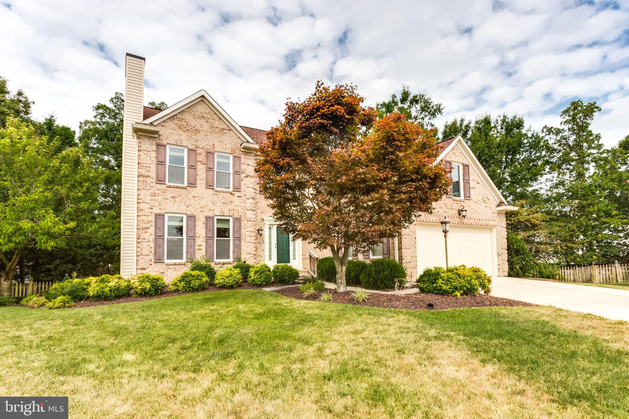 Peacefully located in a tranquil fenced yard setting at the end of a quiet cul de sac this beautiful Two-Story home features a dramatic soaring 2 story foyer. It has large rooms throughout with gleaming Brazilian cherry hardwood flooring all through entire main level, and a main level room that could be an office or 5th bedroom. Upper level hallway that is open to foyer has hardwood floors as well. There are 4 BR s on upper level and many updates and upgrades throughout this beautiful home. So many features are offered   Brazilian Cherry Hardwood flooring, Gourmet kitchen with granite countertops, stainless steel appliances, formal and spacious living and dining rooms, as well as a main level family room with clean gas fireplace. There is a laundry room on upper bedroom level, so you don t have to travel downstairs carrying laundry! Also, a luxurious master suite with hardwood floors and vaulted ceiling and includes huge walk-in closet with custom organizers as well as the en-suite master bathroom with a spa-like huge ceramic tile walk-in shower and two separate sinks and custom cabinetry. There are 3 1/2 bathrooms in all.  Expansive Recreation room/entertainment space in basement with hardwood flooring and a second fireplace, also includes a wet bar, built in wine rack and full bathroom, and 2 other rooms that could be playrooms or den/office area or media room. A beautiful large private rear deck, outdoor shed, gorgeous landscaping complete this home.  This property has been meticulously cared for and well maintained. It s an easy commute to Washington DC, The National Harbor, Joint Base Andrews and points South. It s conveniently located along Route 228 and the major corridors   Rt. 210, 301, the new McDaniel Rd extension, as well as commuter lots to DC. This one has it all! Your new home awaits you in this sought-after Ashford Oaks community!