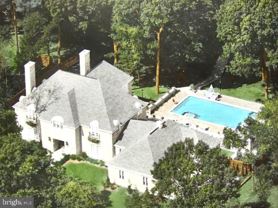 Don’t miss the video link to YouTube! Fully detailed writeup , highlights, and floor plans in photos!
Extraordinary French Normandy–style all-brick waterfront estate, perfectly positioned on Rockawalkin Creek with direct access to the Wicomico River and Chesapeake Bay. This one-of-a-kind residence showcases a spectacular resort-style backyard and extensive renovations completed within the last three years, delivering an unmatched blend of craftsmanship, comfort, and luxury in Salisbury’s sought-after Nithsdale community.
Offering over 5,700 sq ft of finished living space, the home features 3 levels, a new Elevator, 4 bedrooms, 4.5 baths, 2 fireplaces, an attached garage, and unfinished walk-up space above the garage for future expansion. From the moment you enter through the custom carved wood door into the grand marble foyer, the home makes a stunning first impression with its sweeping curved iron staircase and crystal chandeliers.
Designed for exceptional entertaining, the interior flows effortlessly from formal living and dining rooms—each adorned with imported crystal chandeliers and French doors—to an expansive creekside great room rich with millwork, built-ins, a wood-burning fireplace, and a hidden wet bar. The gourmet kitchen anchors the home with a large quartz island, Thermador cooktop, custom copper hood, wall oven, walk-in pantry, and casual dining area overlooking the pool and water beyond.
Step outside to a true private oasis: a 20’ x 40’ resurfaced in-ground pool, spa and hot tub, tiki-style pool bar, outdoor shower, gas masonry fireplace, pergola, gazebo, multi-level brick patios, and lush landscaping. A recently upgraded pier features new decking and pilings, boat lift, floating jet ski dock, kayak racks, ladder, ramp, and solar lighting—perfect for waterfront living at its finest. Additional upgrades include a whole-home generator, circular blacktop driveway, new concrete parking, and impeccably maintained grounds.
Upstairs, the primary suite offers a serene retreat with panoramic creek views, 2 primary bathrooms & 4 walk in closets designed as dual ensuite wings, a jacuzzi tub, tiled shower, makeup vanity, and exceptional privacy. Two additional bedrooms each provide walk-in closets and private balconies, complemented by a fully renovated guest bath. The finished third level offers a large 4th bedroom (no egress window), and fitness space, with additional unfinished storage available.
Community amenities include wide tree-lined streets, boat ramp, playground, tennis and basketball courts, and low HOA fees of just $450 annually. Home and septic inspections are already complete, providing peace of mind. Ideally located near Salisbury University, TidalHealth, downtown Salisbury, beaches, marinas, parks, and major East Coast cities.
Luxury, lifestyle, and livability converge in this rare waterfront estate—an exceptional opportunity for those who value quality, privacy, and unforgettable outdoor living.