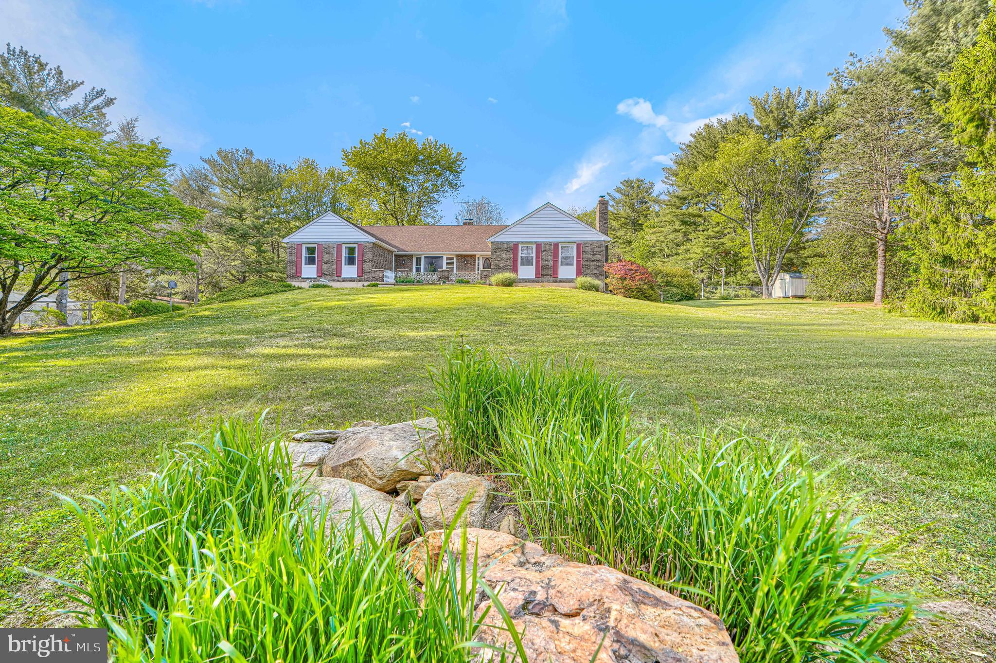 Welcome home to 169 Providence Road — a private 3-bedroom, 2-bath ranch retreat nestled on 3.29 beautifully open acres in the heart of Cecil County's most sought-after horse country. This is the kind of property that stops you the moment you arrive. No HOA, no crowded subdivision, no compromise — just wide open space, fresh air, and a setting that feels worlds away from the noise of everyday life while still being conveniently close to everything that matters.
Inside, the home offers over 2,500 square feet of thoughtfully laid out living space on the main level alone, plus a partially finished lower level that opens up endless possibilities for a rec room, home gym, workshop, or additional living quarters. Wood floors flow through the main living areas, and a second full kitchen adds tremendous versatility — ideal for canning, entertaining large gatherings, or accommodating multi-generational living with ease. The screened porch and deck off the kitchen are where this home truly shines, offering front-row seats to one of the most peaceful views you'll find in Cecil County — neighboring horses grazing lazily across the pasture while you sip your morning coffee. It's the kind of view you never take for granted.
The sellers have done the hard work so you don't have to. Every major system has been updated in recent years: roof replaced 5 years ago, windows replaced 5 years ago, HVAC updated 4 years ago, well tank replaced 5 years ago, and water heater replaced just 3 years ago. Move in with confidence knowing the big-ticket items are well behind you and years of worry-free living lie ahead. A side-entry 2-car garage, abundant storage throughout, and a layout that blends comfort with functionality make this home as practical as it is charming.
Step outside and the 3.29 acres invite you to make this property entirely your own — space for a garden, space for animals, space to simply breathe. The location is the crown jewel for equestrian enthusiasts and nature lovers alike. You're just minutes from Fair Hill Natural Resources Management Area, home to hundreds of miles of scenic trails and the world-renowned Maryland 5 Star, one of the most prestigious equestrian competitions in the country. Quick access to the Pennsylvania state line and the University of Delaware rounds out a location that truly delivers on all fronts.
Properties combining this much acreage, this many updates, horse country living, and a location this close to Fair Hill are rare finds in today's market. Come experience 169 Providence Road for yourself — and prepare to never want to leave.