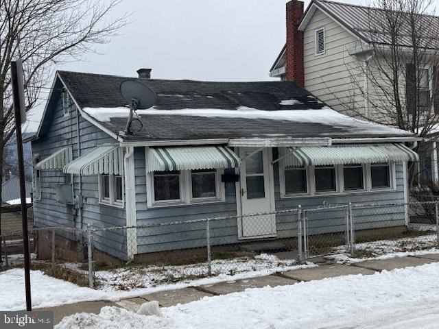 Great Rental!
2 bedroom, 1 bath rancher with solid, long term tenant who pays $555/mo. with Sewer and Refuse included. Replacement windows, economical natural gas forced air heat and natural gas hot water heater. Range and refrigerator convey. Extra storage room and office. Full basement with laundry hookups. Rear open and enclosed porches off of the kitchen. 1 car detached carport and 1 driveway space at rear off of alley. Leased through 10/31/2025.