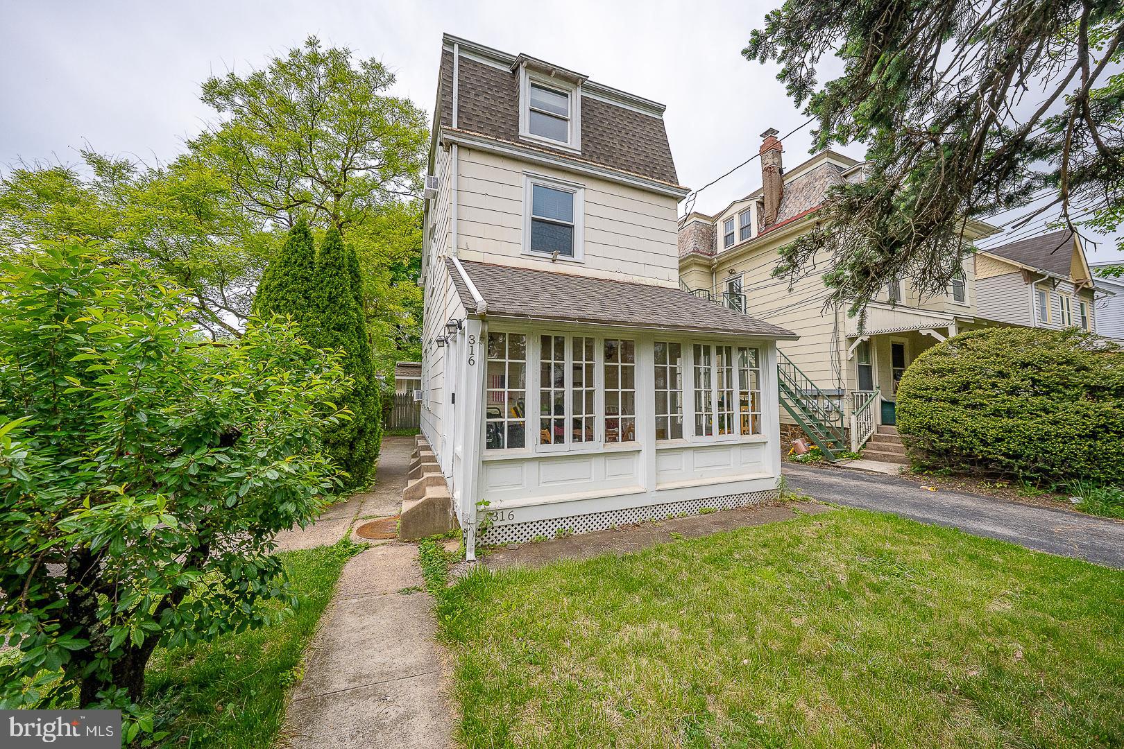 A RARE GEM IN THE HEART OF ARDMORE RIGHT ACROSS FROM SUBURBAN SQUARE! A REAL 4B 2/1 BA SINGLE FAMILY HOME! Beautiful updated and renovated move-in conditions! Enter into the high ceiling, enclosed front sun porch with exposed beams and hardwood floors. High ceilings and recessed lighting throughout first floor. Formal living room. Elegant dining room with crown moldings and corner bar with granite ledge and lighting. Bright and modern kitchen with maple cabinets, stainless steel appliances, breakfast bar nook. In the back, a breakfast room with main floor laundry & updated powder room w/wainscoting leads thru the French doors access to back steps and the all fenced-in private and secluded backyard, ideal for those summer relaxing al fresco dinners. The second floor features three nice sized bedrooms and  a completely renovated full bathroom with deep soaking tub, tiled flooring and upgraded vanity. The third level has the main suite with walk-in closet, a large full bathroom with ceramic tiling & whirlpool tub. Replacement windows throughout. 200 amp electric & exterior service cable. Hardwood flooring in Sun/rm, LR & DR. Unbeatable location close to everything! All shopping, restaurants and parks in Suburban & Haverford Squares,  Ardmore shopping. Lower Merion schools. Close to the R5 train short ride to Philly! This type of home does not come along easily, schedule your showing today before it's too late!