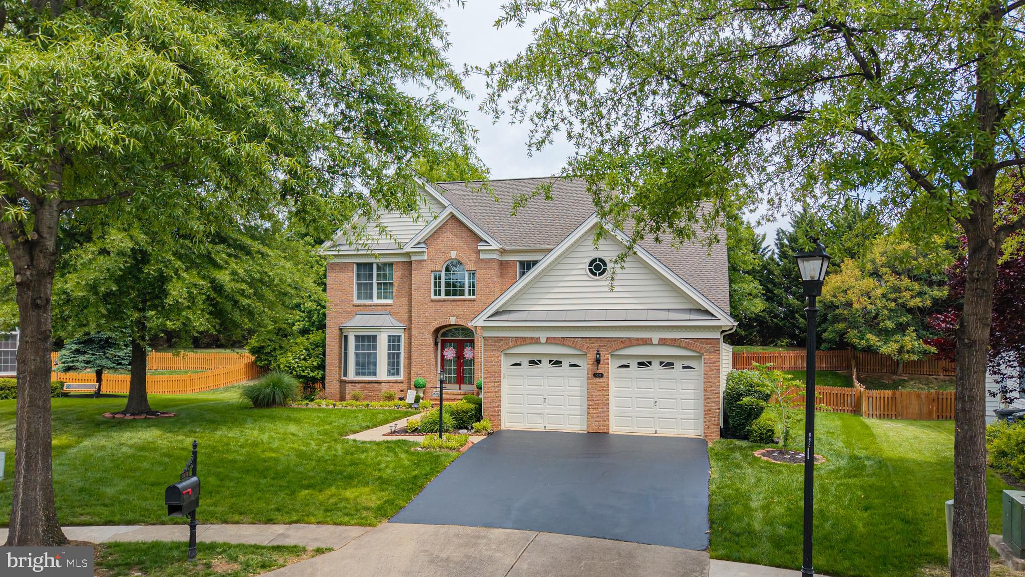 Immaculate Arlington model tucked away on a quiet cul-de-sac in the gated golf course community of Dominion Valley Country Club! Situated on a private .24-acre lot backing to mature trees and common area, this beautifully updated home offers over 4,600 square feet of elegant living space, exceptional outdoor entertaining, and incredible value. A dramatic two-story foyer, hardwood flooring, solid wood stairs with wrought iron spindles, and extensive custom molding create an impressive first impression. The updated gourmet kitchen features granite countertops, newer GE Profile stainless steel appliances, gas cooktop, and opens seamlessly to the spacious family room with gas fireplace. The oversized primary suite offers a sitting room and two walk-in closets with custom closet systems. The finished lower level is ideal for entertaining with a granite wet bar, full-size refrigerator, spacious rec room, full bath, and large storage room. Outdoor living shines with an expansive maintenance-free deck, stamped concrete patio with seat wall, and fully fenced backyard — perfect for entertaining or relaxing in total privacy. Additional highlights include a brand new roof, new main-level HVAC, EV charger, and irrigation system. Enjoy Dominion Valley’s resort-style amenities including indoor and outdoor pools, golf course, clubhouse, fitness center, tennis courts, trails, and more. World-class amenities include an Arnold Palmer Signature golf course, renovated clubhouse, state-of-the-art Sports Pavilion, five swimming pools including an indoor pool, tennis and basketball courts, playgrounds, miles of walking and biking trails, and two fishing ponds.
Award-winning schools!