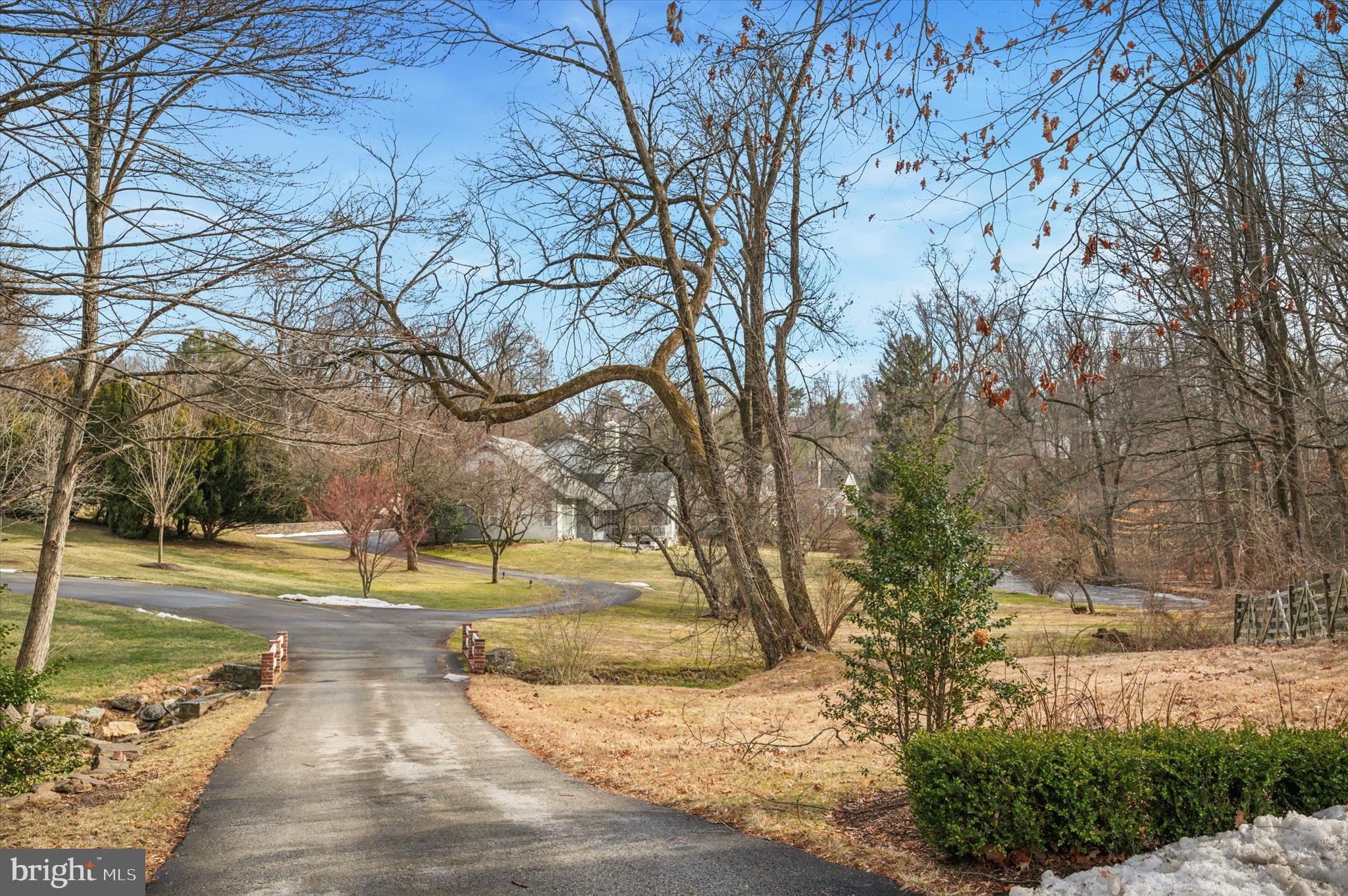 Enter this beautiful home at the end of the cul-de-sac on the North side of Bryn Mawr.  This Ann Capon
design home was a custom built home in 1983.  The entry hall overlooks a massive great room with double 
story ceilings .  There is a guest powder room off of the entry hall.   To the right of the entry way is the private primary suite with a private bath.  To the left of the entry is the kitchen and breakfast room and off of the breakfast room is a cozy den.  There is a back hallway where there is a home office and a two car attached garage.  On the second floor there are two bedrooms with ensuite bathrooms for each.  This house is filled with natural light, there are floor to ceiling windows in every room.  There at terrace off of the kitchen, den and living room for outdoor entertaining.