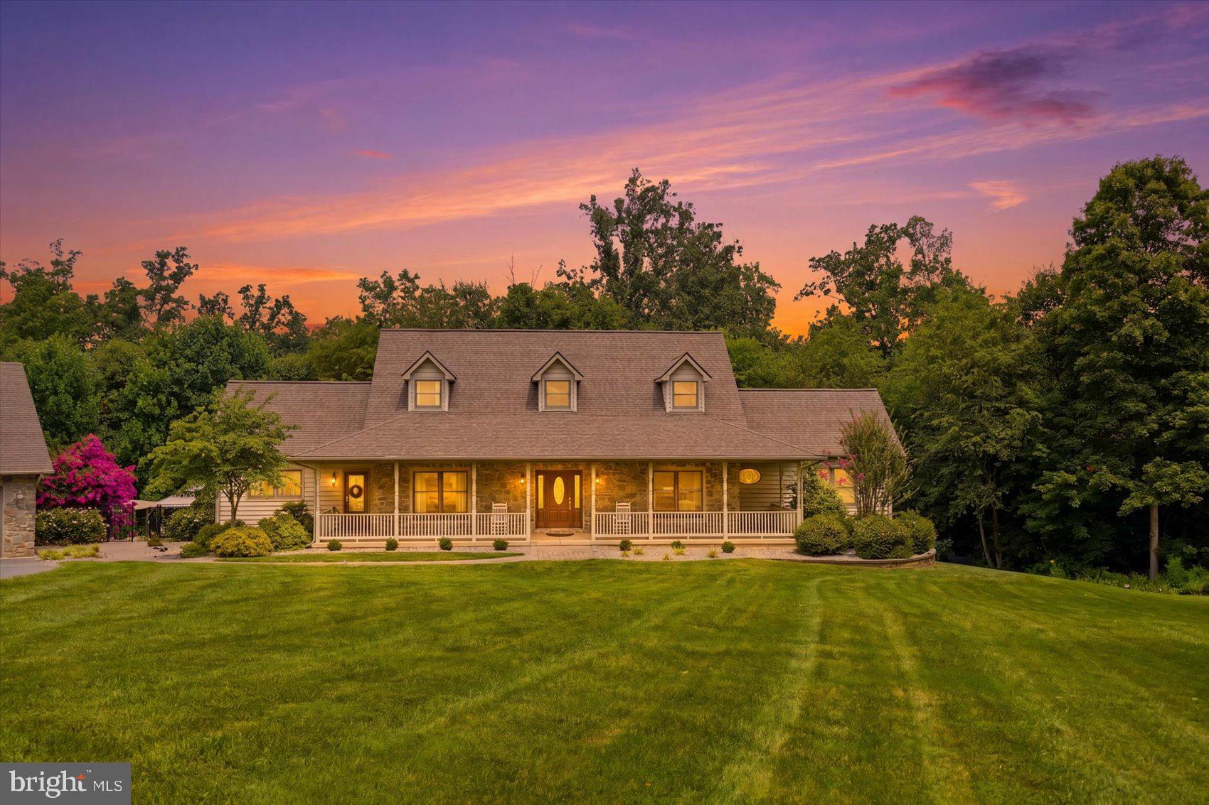 A truly rare offering in Carroll County, 1070 Fannie Dorsey Road presents nearly 30 acres of unmatched privacy, endless possibilities, and an ideal commuter location just off Route 97. Opportunities like this are few and far between—a thoughtfully maintained estate where you can create the lifestyle you've always envisioned while remaining just minutes from downtown Sykesville, Howard County, Fort Meade, shopping, dining, and major commuter routes. Here, you'll feel like you're miles from everything while being close to it all.

The outdoor amenities make this property unlike any other. Explore approximately one mile of private wooded trails winding through nearly 30 acres, complete with a peaceful stream, abundant wildlife, and exceptional hunting opportunities - including a150-yard range for target practice.  The impressive detached three-car garage provides ample space for vehicles, boats, or a workshop.  The second 3 car garage adds additional space for equipment, hobbies, animals, and storage.  Whether your dream is horses, goats, livestock, gardens, ATV trails, or simply owning your own private retreat, this extraordinary property provides the space and freedom to make it a reality.

After enjoying everything the land has to offer, you'll appreciate the beautifully updated home, built in the 2000s with a spacious, functional layout designed for family living and entertaining. The heart of the home is the stunning custom kitchen, completely renovated in 2020 with high-end finishes and premium appliances. The primary suite was further enhanced with a beautifully remodeled spa-inspired bathroom in 2023. The fully finished lower level includes a complete in-law suite, creating exceptional flexibility for multigenerational living, extended family, or long-term guests.

Step outside to the spectacular in-ground pool, offering the perfect place to relax, entertain, and enjoy the peaceful surroundings after a day spent exploring your own private estate.

Properties that combine 30 acres, extensive recreational amenities, agricultural potential, a beautifully updated home, and an unbeatable commuter location are exceptionally rare. Served by sought-after Linton Springs Elementary and Century High School, this is more than a home—it's an opportunity to build the lifestyle you've been dreaming about.