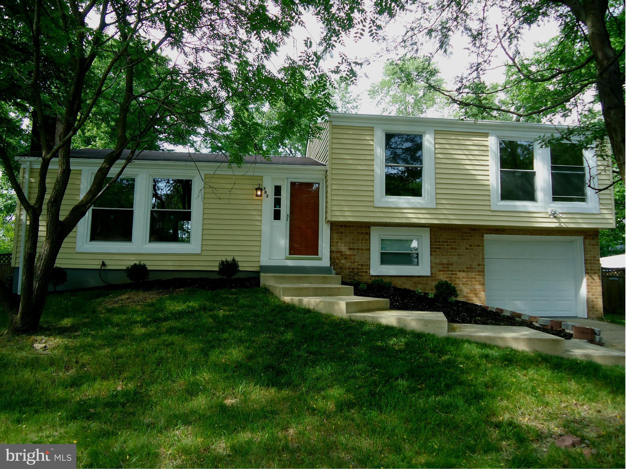 Gorgeous 4 Level Single Family Home! Renovated and move in ready..features cherry hardwood flooring in main level, spacious kitchen, brand new cabinets, granite countertops, backsplash  & SS appliances.  Remodeled baths with skylight windows! Brand new HVAC and water heater! Two rec rooms for entertainment and a fully fenced backyard.  Convenient location!