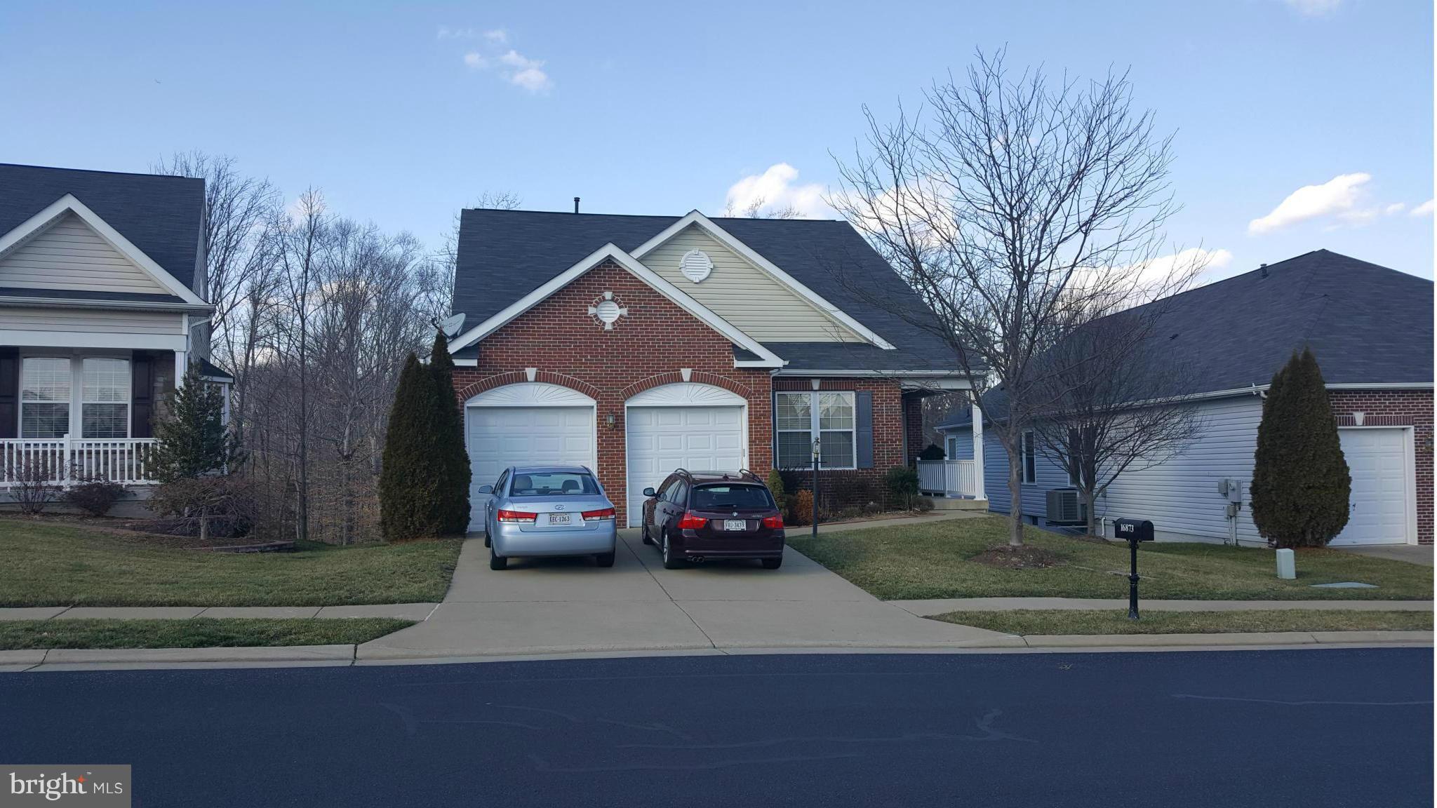 REDUCED PRICE! POTENTIAL SHORT SALE, "AS IS" **WELL MAINTAINED**, SHOW WELL, 55+ gated Community, located in historic area.  Great neighbors and pet friendly.  KITCHEN W/ CORIAN COUNTERS, FAMILY RM W/ FIREPLACE, LUXURY BATHS AND SEPARATE SHOWER, HARDWOOD AND CARPET, 3 BEDROOMS, 4 FULL BATHS, 2 FIREPLACES.  Guest room and Theater in the basement. Don't lock the bolt one in front door nor garage one