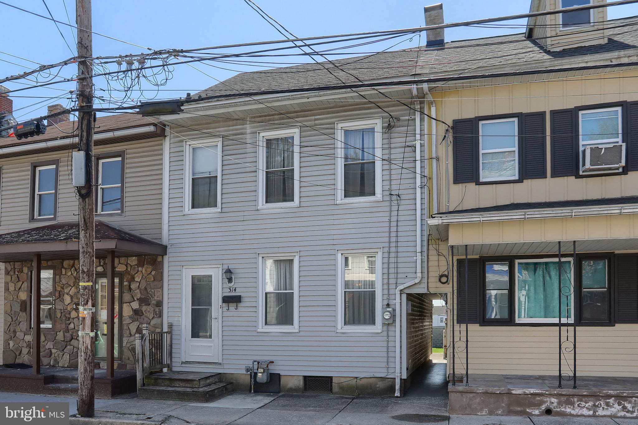 ** OFFER DEADLINE has been set for Monday, 4/13/2025 at 4pm ** This interior rowhome in Lebanon City is ready for a new owner!   Offering large rooms, high ceilings – there is TONS of potential with this home!  The main floor consists of a living room, dining room, kitchen, laundry area and a full bathroom.  On the second floor, you’ll find 3 hall-entered bedrooms and a 2nd full bathroom.  There is a walk-up attic that offers extra storage space. The covered back porch and low maintenance back yard offer a FUN place to gather with family and friends for outdoor enjoyment. The unfinished basement offers additional storage space.  There is an oversized detached garage, which previously served as a carpentry shop.  Accepting Cash or Conventional offers only! This home is a definite must-see! Schedule your showing today!