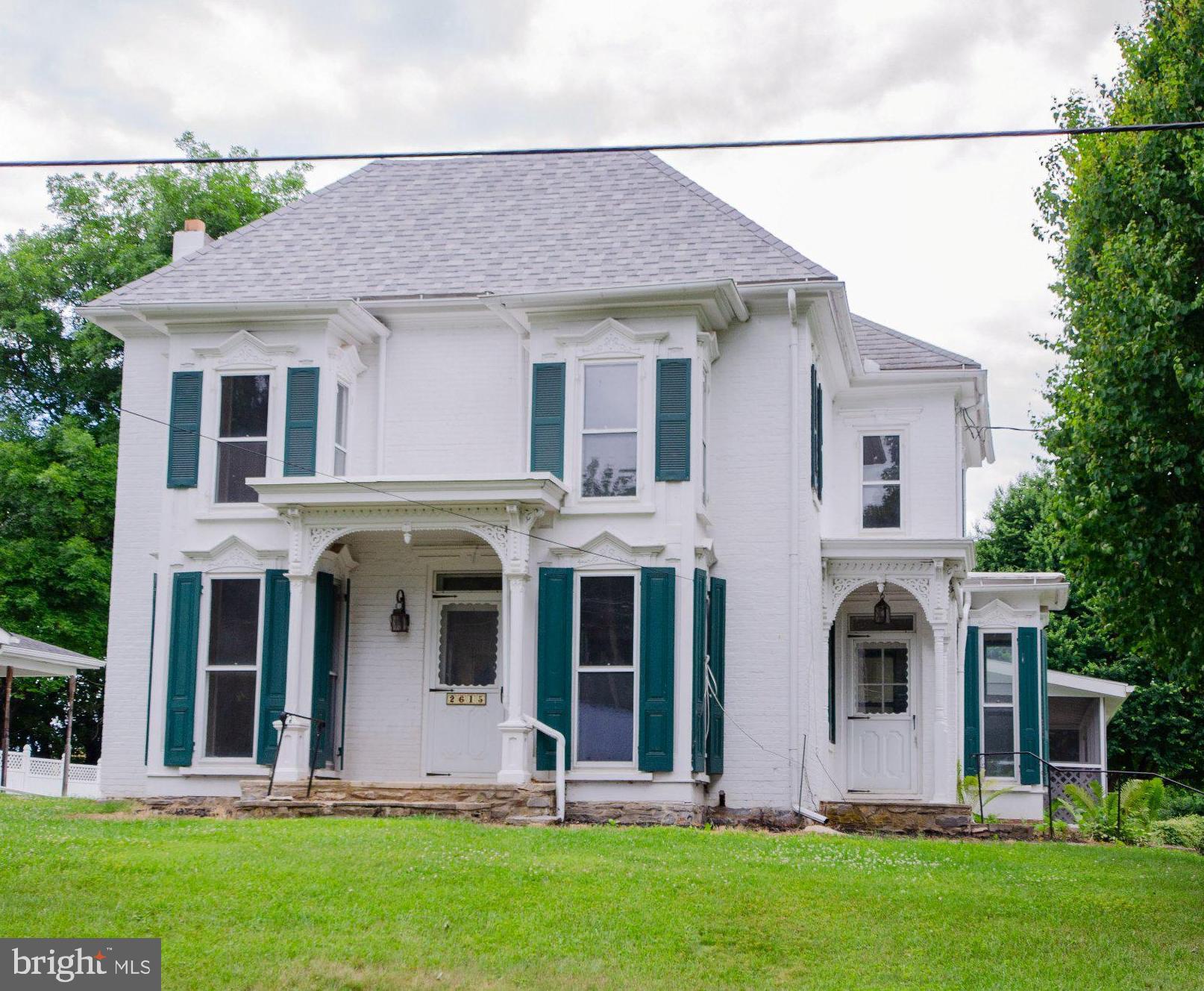 UPDATED WITH NEW PRICE!  CENTRAL AIR w/ Heat Pump & Mini Split to be installed.  Historic Colonial style home nestled in a serene rural setting just outside of Carlisle.  This home was originally built in 1800 and thoughtfully renovated in 2025/2026, offers a harmonious blend of classic, original charm and modern updates. Spanning over 2,000 square feet, this brick home was built to last and was designed for both comfort and efficiency.  Stays cool in the summer and warm in the winter.  As soon as you step inside, you'll discover a warm and inviting interior adorned with beautifully refinished, rich hardwood flooring throughout.  The heart of the home features a new galley kitchen equipped with tall, soft close cabinetry, upgraded granite countertops, and high-end, stainless steel appliances, including a electric oven/range, refrigerator, dishwasher, and microwave. The kitchen opens to a cozy family room, ideal for casual gatherings, while a formal dining room provides plenty of space for entertaining. The den is perfect for small gatherings or just some alone time in front of the wood burning fireplace.  This home boasts three spacious bedrooms, each designed to be a personal sanctuary. The primary bathroom features double sink vanity and an upgraded tub / shower, perfect for unwinding after a long day.  Another great feature are the porches with handcrafted accents and screened in patio, perfect for enjoying morning coffee or evening sunsets. Stone retaining wall enhances the outdoor aesthetic.  The oversized one car detached garage has a small work area and storage area up top.  The huge 47 x 30 pole barn / garage offers more than ample storage and workspace for hobbies or projects and includes an additional one car garage behind.  The asphalt driveway accommodates plenty of parking for multiple vehicles, ensuring convenience for you and your guests. Experience the perfect blend of historic elegance and charm and modern updates in this stunning property, where every detail has been thoughtfully curated to provide a sense of home and comfort.  Call today for a tour!