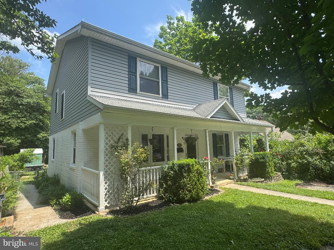 Charming Five-Bedroom Home in the Heart of Rockville

Welcome to this charming and spacious home offering a flexible floor plan, timeless character, and an ideal Rockville location. A covered front porch provides wonderful curb appeal and a perfect place to relax and enjoy the neighborhood.
The main level features beautiful hardwood floors throughout, an updated kitchen, a comfortable family room, a main-level bedroom, and a full bathroom—offering excellent flexibility for guests, a home office, or multigenerational living.
Upstairs, you'll find four generous sized bedrooms and a full bath, including a spacious primary bedroom with a private balcony overlooking the fenced backyard. For added convenience, the laundry area with a full-size washer and dryer is also located on the second level, making everyday living even more functional.
The level, fenced backyard offers plenty of space for entertaining, gardening, pets, or play and includes a patio and a storage shed for added convenience. A walkout lower-level basement provides abundant storage space and houses the home's mechanical systems.
Conveniently located in the heart of Rockville, this home offers easy access to Metro, commuter routes, shopping, dining, parks, and top Montgomery County amenities. With five bedrooms, two full baths, a versatile layout, and a wonderful outdoor living space, this home presents an exceptional opportunity for today's buyers.