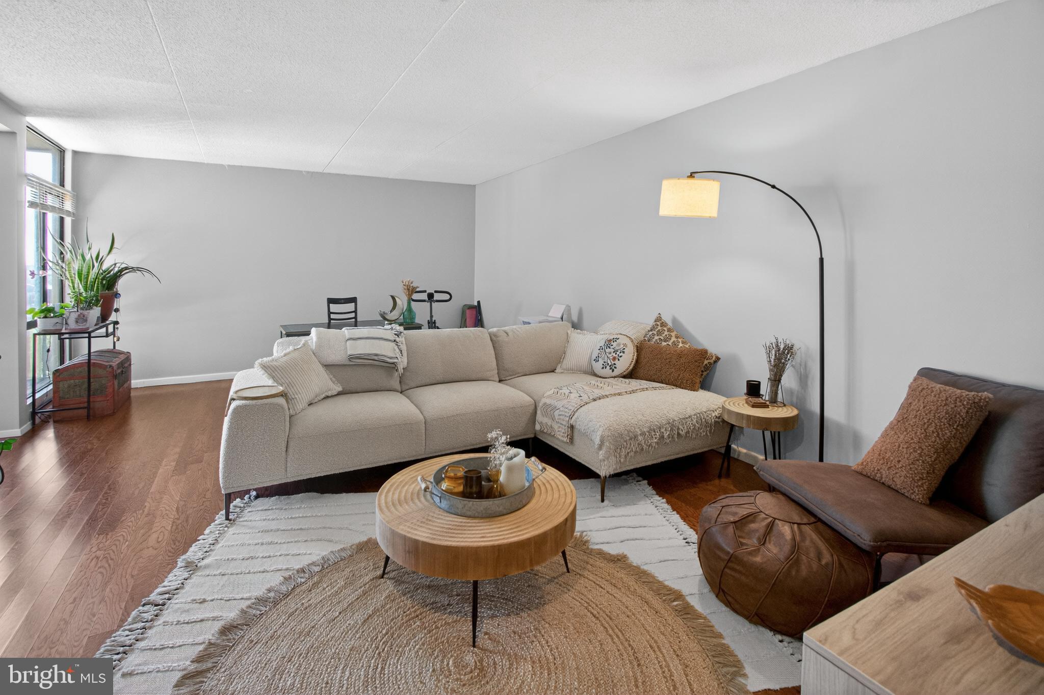 Beautifully updated and meticulously maintained, this 2-bedroom, 1-bath residence is located on the 10th floor of the sought-after Sentinel of Landmark condominium and offers peaceful tree-top views from a private balcony. Enter to updated flooring that flows seamlessly throughout the spacious and inviting living area. The kitchen boasts freshly painted cabinetry, granite countertops, a stylish accent backsplash, and updated stainless steel appliances, including a range stove, dishwasher, and garbage disposal (2021-2023), plus an updated faucet (2025) and enhanced pantry shelving, offering both style and optimal organization. Filled with natural light, the adjacent dining area, complete with a modern light fixture, flows effortlessly into the living room, creating the perfect setting for relaxing or entertaining while taking in the scenic views through expansive floor-to-ceiling windows. The spacious primary bedroom features a generous walk-in closet complete with custom built-ins (2025) and convenient access to the updated full hall bath with a tub/shower combo. Just across the hall, the secondary bedroom is ideal for a guest room or in-home office. An in-unit washer and dryer, along with a coat closet and linen closet, add everyday convenience. Step outside onto the private balcony to enjoy your morning coffee or unwind in the evening while admiring the beautiful Alexandria views. Additional recent updates include the HVAC motor and capacitor (2023), a bathroom refresh featuring updated wallpaper, mirror, and shelving (2024), new shower head, faucet, and drain (2025), new toilet (2025), new vanity faucet and drain (2025), replacement of the copper piping behind the shower and washer/dryer (2025), and all new door knobs and closet knobs. Residents enjoy a secure building entrance, one assigned parking space (A56), plus an additional open lot parking pass, along with an impressive array of amenities, including an outdoor pool, fitness center, sauna, playground, dog parks, community room, bike storage, and package storage for added convenience. Ideally located, this home offers easy access to Stevenson Park with playgrounds and sports courts, local shopping and dining options, Van Dorn Street Metro (Blue Line), and Reagan National Airport (DCA). VA and FHA approved, don’t miss this!