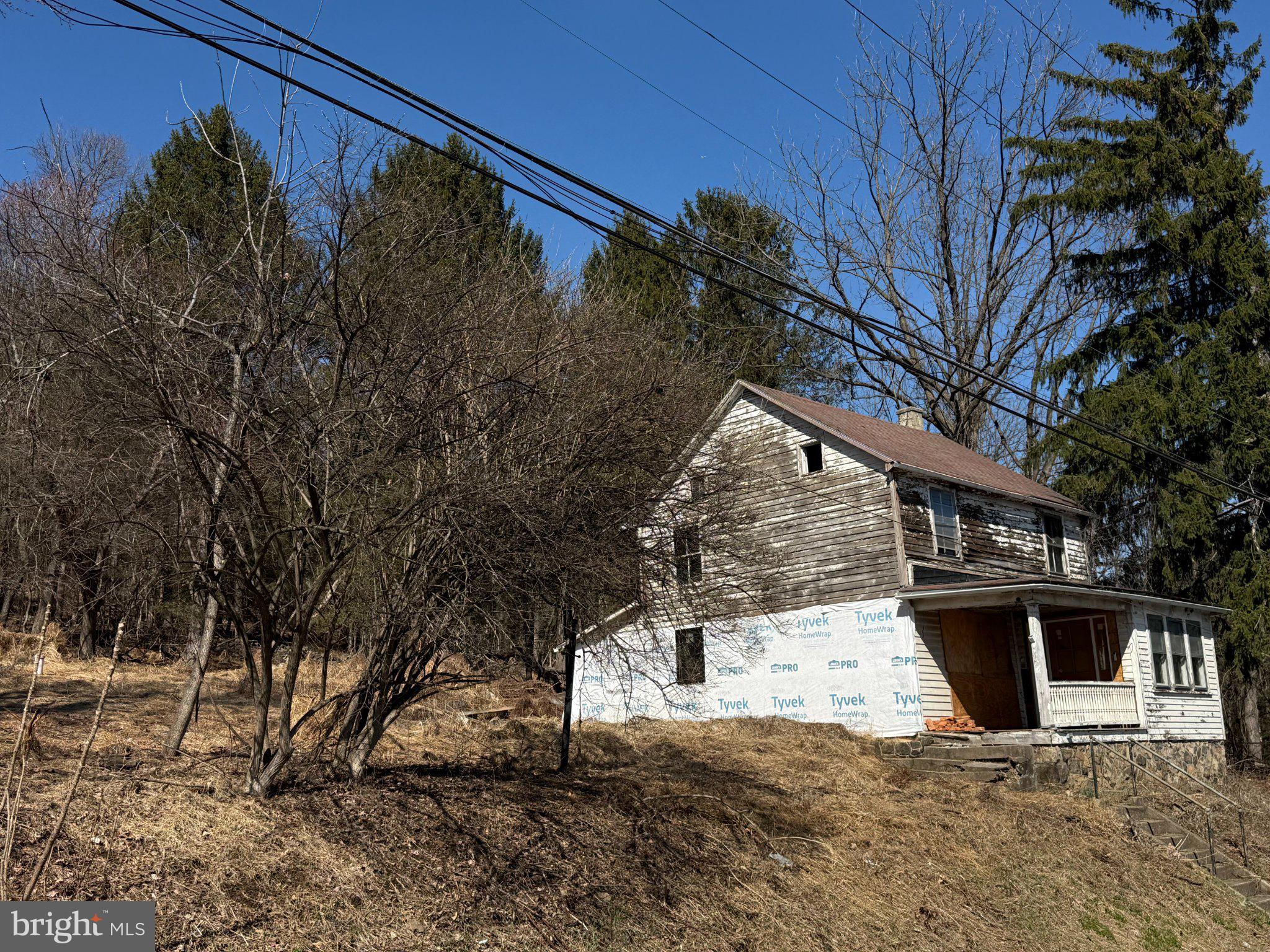 This property presents a great opportunity for someone with vision. Situated on 1.5 acres and including an additional 1-acre lot across the street, the total acreage exceeds 2.5 acres, offering ample space for a variety of possibilities.

The existing home requires rehabilitation, providing the option to restore it or build new to suit your needs.

Ideal for those looking to renovate, build, or invest, this property offers the chance to make full use of a substantial piece of land and create something truly your own.