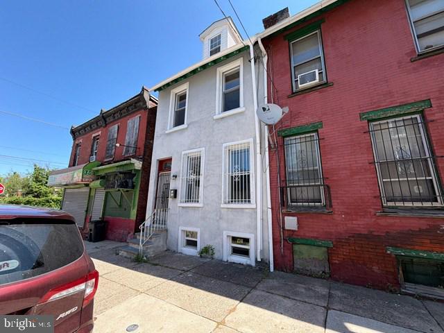 Located in the rapidly developing Mantua section of Philadelphia, 317 N. 38th St. offers a flexible layout and a strong foundation for a buyer ready to add their own finishing touches. The first floor features an open living and dining area that flows into the updated kitchen with stainless steel appliances including a gas range, refrigerator, microwave, and dishwasher, along with a convenient powder room. The second floor includes two bedrooms, an updated full bathroom, and a washer/dryer area, while the third-floor loft-style bedroom provides additional living space filled with natural light. A finished basement adds bonus recreational or storage space, and the fenced rear yard offers privacy and room for outdoor enjoyment. With central air and heat already in place and convenient access to University City, public transportation, and major roadways, this property presents a great opportunity for an owner-occupant or investor looking to build value in a growing neighborhood.