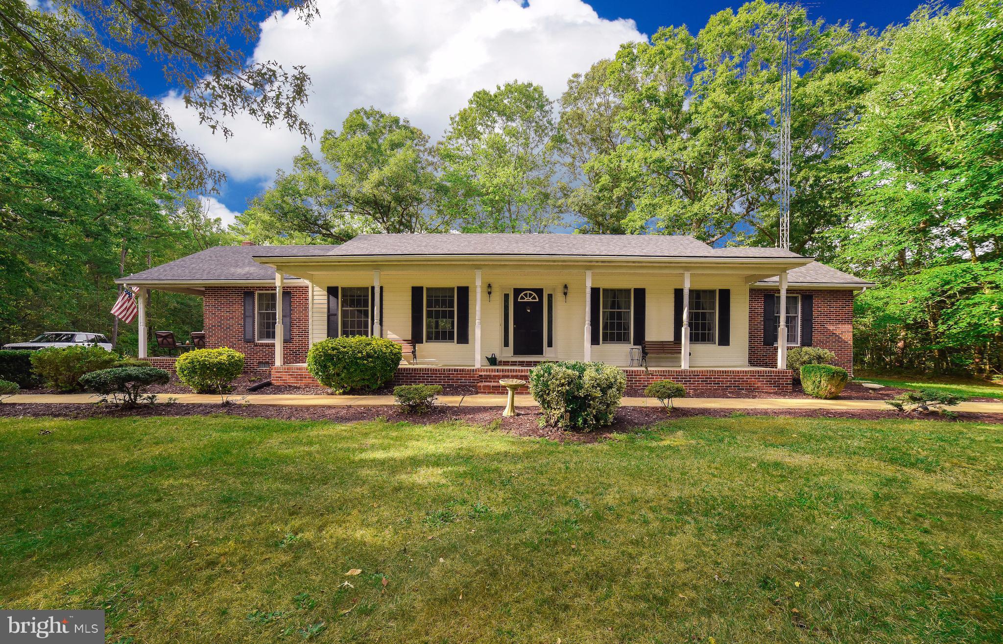 Solid Rambler located on Medleys Neck Rd with easy access to all points North and South. Nice kitchen with breakfast bar, wall oven, gas cooktop open to large family room with pellet stove, and french doors leading to deck and nice backyard.  Bedrooms are nice size.Master bedroom w/WIC and great updated bath.  Detached garage with plenty of room for the mechanic, and large rear room for mancave!!