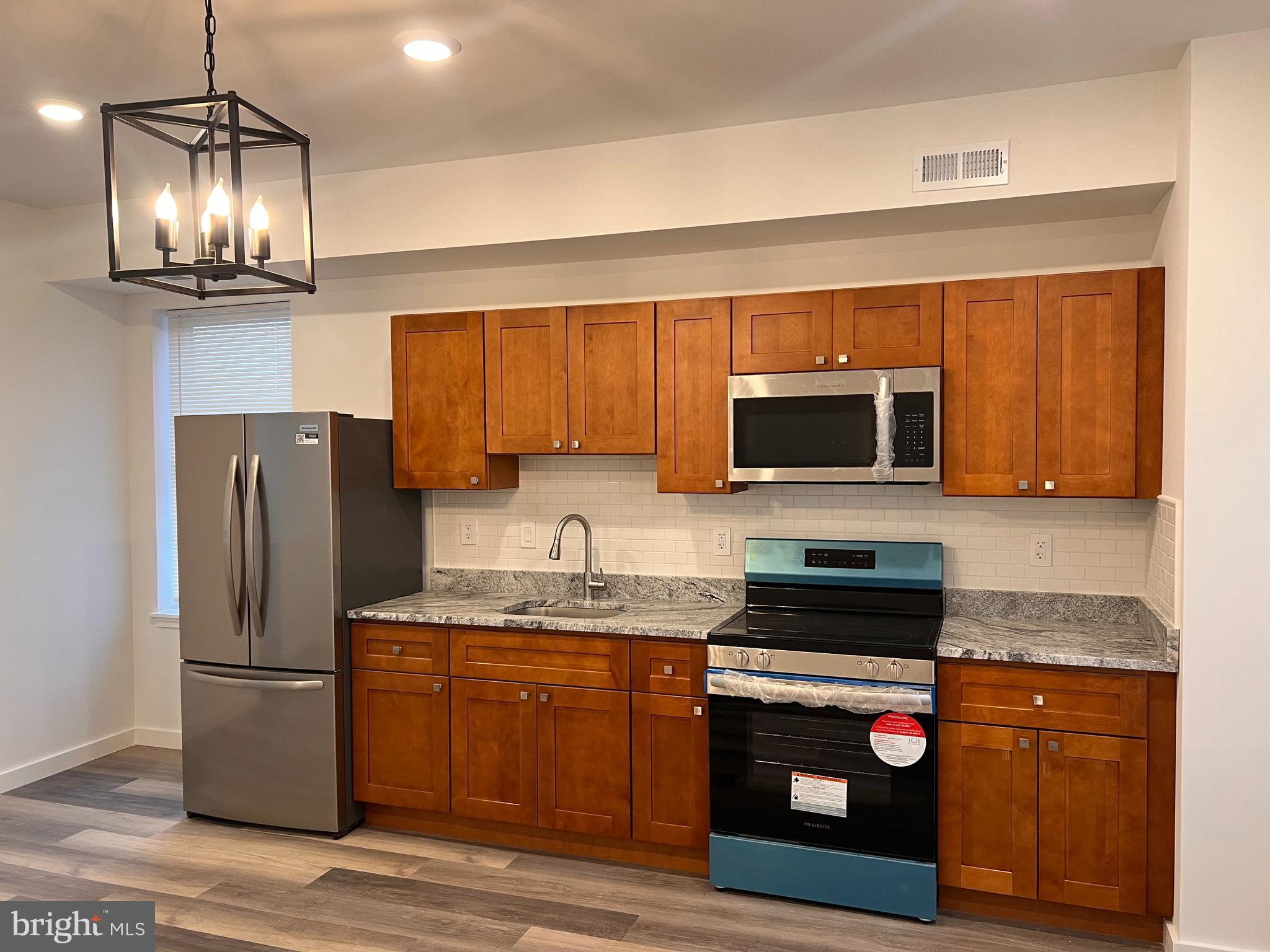 Welcome to 2035 W Toronto St, Philadelphia, PA 19132, a beautifully fully rehabbed and modernized duplex unit in the heart of Glenwood. This spacious three-bedroom, one-bathroom home has been meticulously renovated from top to bottom, offering a perfect blend of comfort, convenience, and style.
Step inside to discover an open and airy floor plan designed for effortless living. The brand-new kitchen is a standout feature, boasting sleek stainless steel appliances, elegant cabinetry, and modern finishes that make cooking and entertaining a delight. Each bedroom offers deep closets for ample storage, while ceiling fans provide additional cooling alongside the central air and heating system for year-round comfort. The unit has been fully renovated with high-end finishes and features three large bedrooms, a modern kitchen, and an in-unit washer and dryer for added convenience. Located on a quiet block with neighboring homeowners, this first-floor, entry-level unit offers a peaceful and welcoming community. Section 8 voucher holders are welcome. This stunning unit will not last long! Schedule your tour today and make 2035 W. Toronto Street #2 your new home!