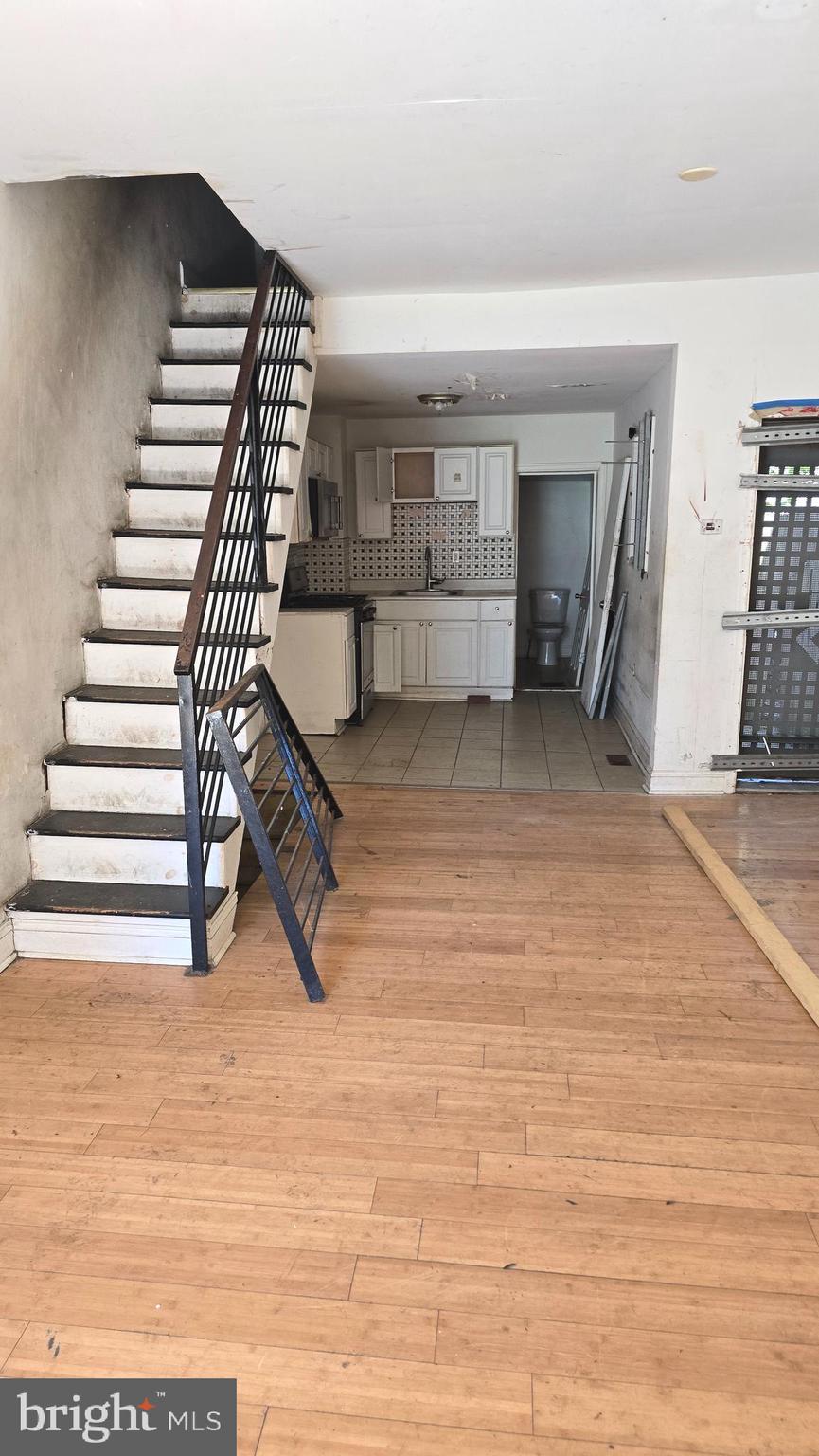 Don't miss this excellent investment opportunity in the rapidly growing Brewerytown/Strawberry Mansion area of Philadelphia! This 3-bedroom, 1.5-bath rowhome was fully renovated approximately five years ago and offers a fantastic chance to add value with mostly cosmetic improvements.

The previous tenant has vacated the property, and while it could use a thorough cleaning, fresh paint, and minor repairs, much of the heavy lifting has already been done. The home features an open-concept first floor with hardwood-style flooring, modern metal stair railings, an updated kitchen with white cabinetry, tile backsplash, and stainless steel appliances.  The contemporary bathroom offers stylish tile finishes, while gas heat and central air provide year-round comfort and efficiency.

Whether you're looking for your next flip, a buy-and-hold rental, or a property to renovate and occupy, this home offers strong upside without requiring a full-scale rehab.

Property is being sold As-Is. Buyer is responsible for any city certifications or requirements. Schedule your showing today and bring your vision!