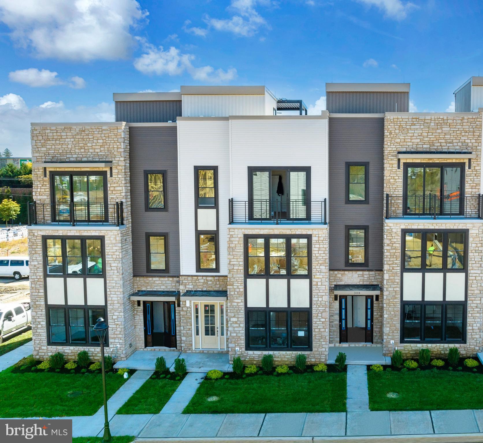 Step into the embrace of this enchanting 3-bedroom, 3.5-bathroom end unit townhome, poised for completion and eagerly awaiting your arrival in Winter 2024/2025. This year, treat yourself to an extraordinary gift – a pristine, low-maintenance haven bathed in natural light.

Nestled within the vibrant community of The Towns at Newtown Walk, this end unit home gleams like a precious gem, boasting an exceptional floor plan adored by our residents. Upon entry into the foyer on the first level, you'll be enveloped in the space's radiant charm. Designed for your convenience, this level features a handy coat closet, a flexible guest bedroom or office space, and a full bathroom. The rear 2-car garage and spacious 2-car driveway offer ample parking and convenient access.

Ascending to the primary living level, prepare to be enchanted by the natural light cascading through numerous windows, accentuating the already lofty 10-foot ceilings and the expansive layout. The kitchen, aglow with sunlight, commands attention with its 42" soft-close cabinets, gleaming quartz countertops, a magnificent island, stainless steel appliances, and dazzling hardwood floors. Hosting guests becomes a delight in the luminous dining area, while relaxation beckons in the spacious living area, complete with a cozy gas fireplace.

The sun-drenched primary bedroom easily accommodates a king-sized bed, dresser, and nightstands, with generous space in the expansive walk-in closet for your wardrobe and shoe collection. Unwind in the ensuite bathroom, where natural light dances upon the walk-in shower with a bench, the private water closet, and the double vanity.

A hallway with laundry facilities leads to a second large bedroom with an ensuite bath. However, the true treasure of this remarkable home awaits – the rooftop terrace, surrounded by windows that bathe the space in radiant light. Imagine savoring your morning coffee as the sun rises or enjoying al fresco dinners with loved ones. This space even allows for planter gardening and the potential for a fireplace or BBQ area.

Being an end unit, this townhome is adorned with extra windows, ensuring an abundance of natural light from every angle. The Towns at Newtown Walk offers a final opportunity to join the thriving Ellis Preserve community. With easy access to major roadways, the airport, the train station, and Routes 252 and 3, your daily commute is effortless.

Please note that actual home finishes may vary, as this home is currently under construction. Don't miss the chance to claim this exceptional, well-lit, and contemporary 3-bedroom, 3.5-bathroom townhome as your new sanctuary!