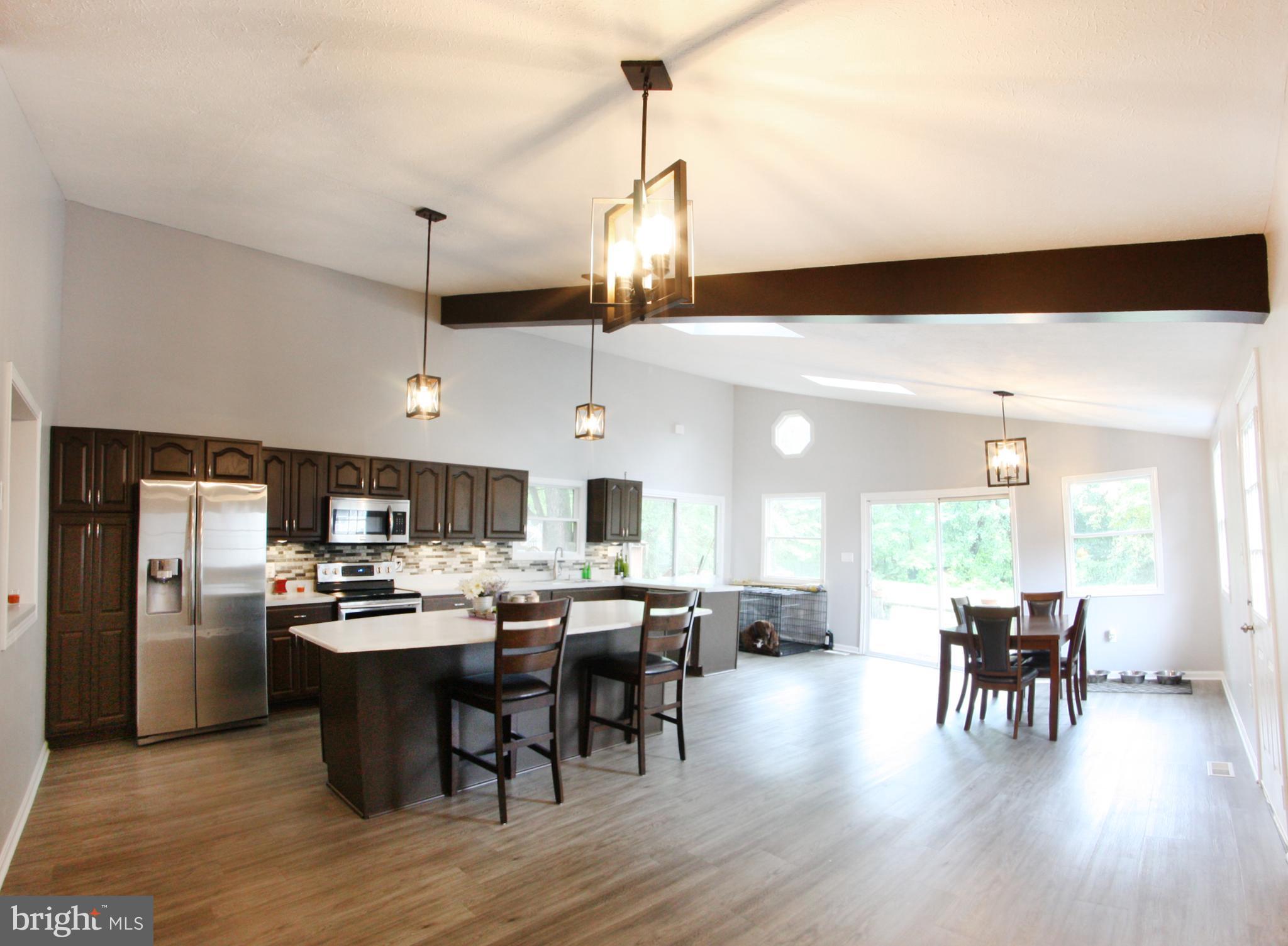Gorgeous completely remodel home on quite street.  This 3 bedroom 2 bath home has all new flooring throughout. Both bathrooms have been remodeled.  New roof (April, 2018), seamless gutters, and all new water and sewer lines.  House has a large open floor plan with remodeled kitchen which looks out on to the large fully fenced in backyard