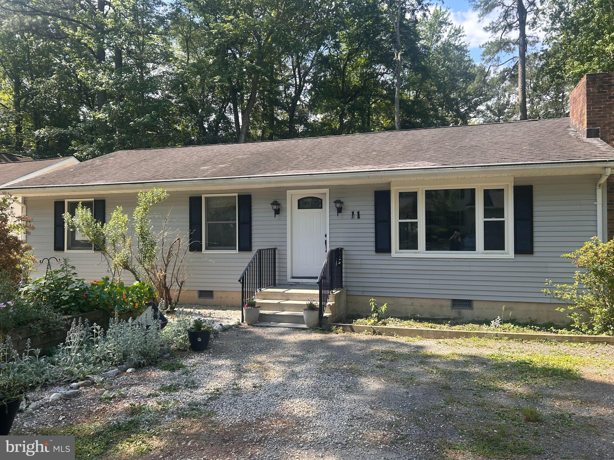 Opportunity awaits with this 3-bedroom, 2-bath home featuring a cozy fireplace, screened-in porch, fenced backyard, and a new hot tub. The functional floor plan and desirable outdoor living spaces provide a great foundation for customization.   Located in the popular community of Ocean Pines, this property provides access to an impressive selection of amenities, including swimming pools, a golf course, a marina, a beach club, parks, and scenic walking paths. Enjoy the best of coastal living with Ocean City’s beaches, restaurants, shops, and entertainment just a short drive away. Whether you're looking for a primary residence, vacation getaway, or investment opportunity, this home offers an excellent location with endless possibilities.