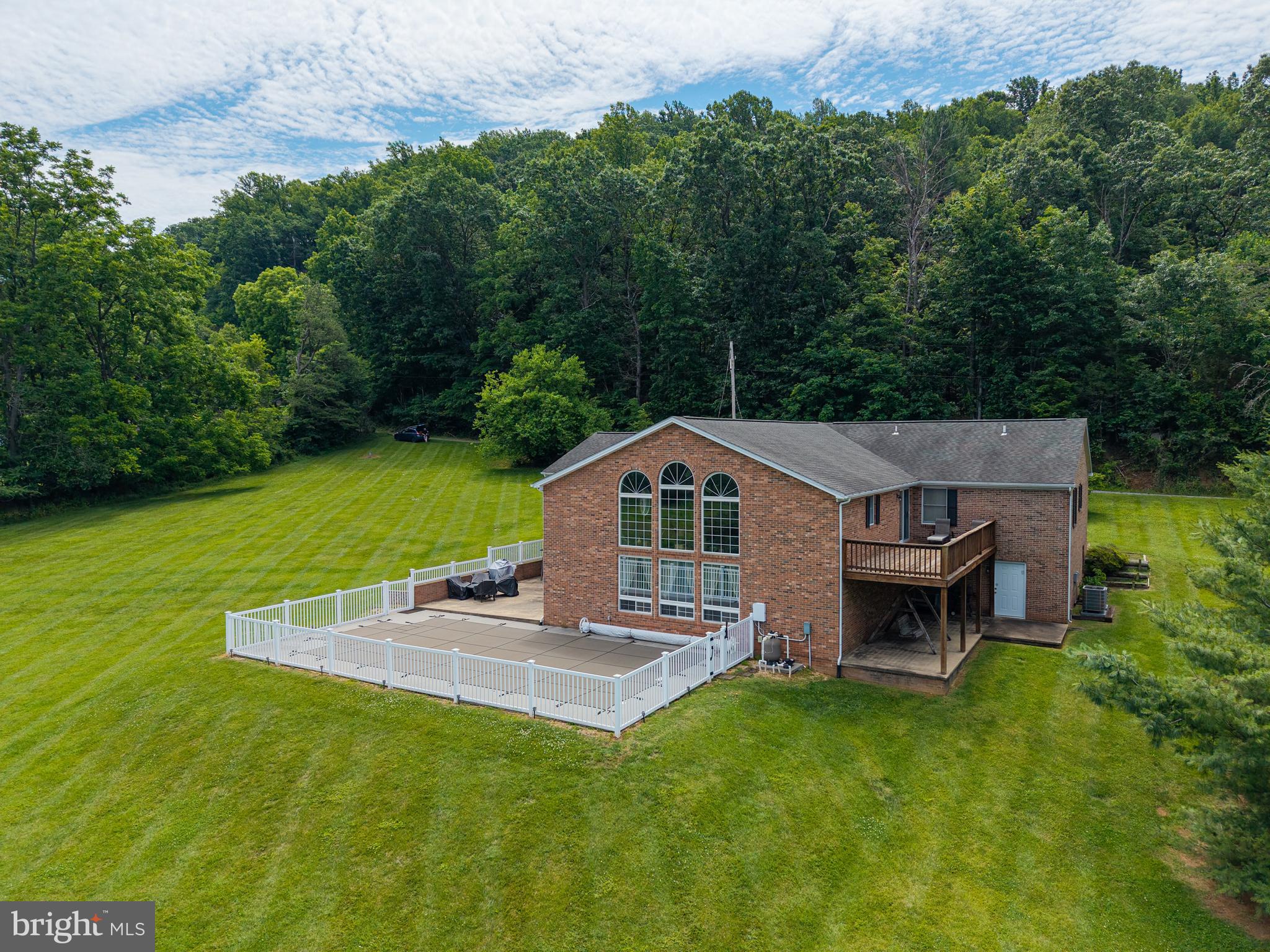 Beautiful Full Brick Ranch with Mountain Views, Pool & Spacious Living

Discover this stunning full brick ranch-style home offering approximately 2,950 sq. ft. of finished living space, plus a full unfinished basement beneath the main level providing incredible storage or future expansion potential.

Situated on 1.32 acres in a beautiful location with peaceful mountain views, this home combines comfort, space, and outdoor enjoyment. A large addition enhances the floor plan, creating an impressive flow ideal for both everyday living and entertaining.

Inside, you’ll find 3 to 4 bedrooms and 2 1/2 baths, including a remodeled kitchen designed with modern convenience in mind. The home also features a formal dining room and an expansive family room with massive wall of windows plus woodstove, perfect for gatherings, relaxation, or cozy evenings at home. Generous storage areas throughout add to the home’s practicality.

Step outside and enjoy a two-car attached garage, a spacious deck, and a large patio overlooking the backyard. The highlight is a beautiful in-ground pool, creating a private outdoor retreat ideal for summer enjoyment and entertaining.

With its solid brick construction, generous square footage, flexible layout, scenic setting on  1.32 acres, this property offers a rare combination of space, comfort, and lifestyle.