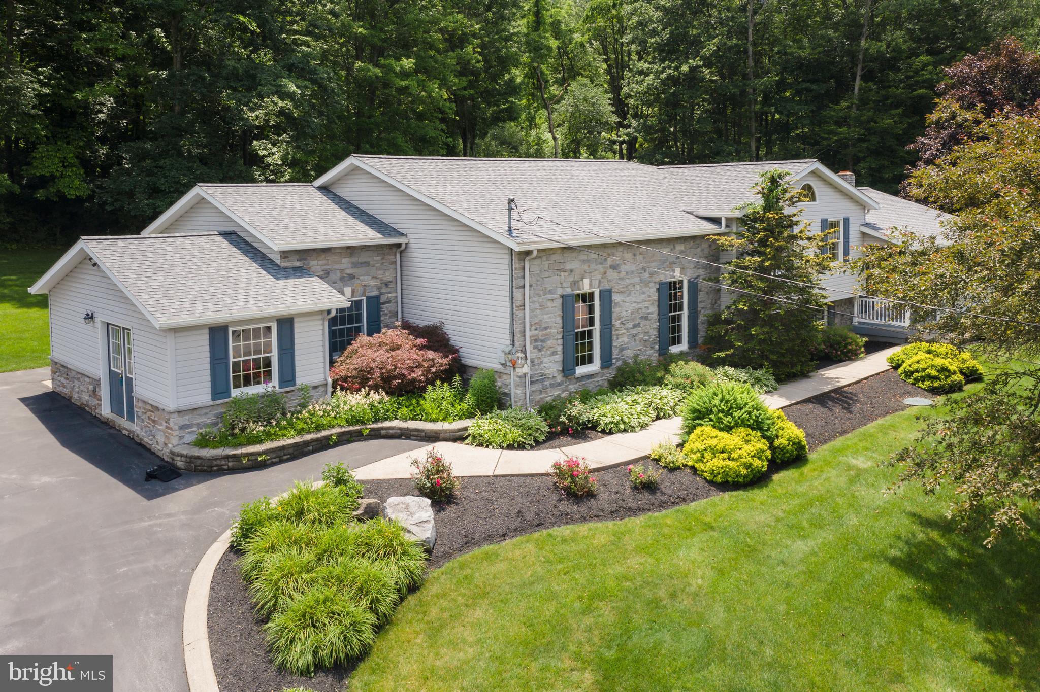 Set on a peaceful stretch of countryside, 443 Stevenson Road offers the perfect blend of privacy and convenience. This well‑maintained home sits on a generous lot surrounded by mature trees and open views, creating a serene retreat ideal for anyone seeking space without sacrificing proximity to town. 
Inside, you’ll find a warm and inviting layout with bright natural light. Flexibility for family and guests with spacious living areas which include a living room, huge great room and rec room. Three fireplaces, one in the primary bedroom suite. Large office with built in desks and filing cabinets. Brand new appliances in the eat-in kitchen. Two heat pumps for cooling and heating. Step outside to a separate garage featuring 2 bays with workbenches and storage units, a half bath and a heated room currently used a s a gym. 
With easy access to State College, Penn State, parks, trails, and major commuter routes, 443 Stevenson Road combines rural tranquility with everyday convenience. A wonderful opportunity to own a home that offers both comfort and room to grow.