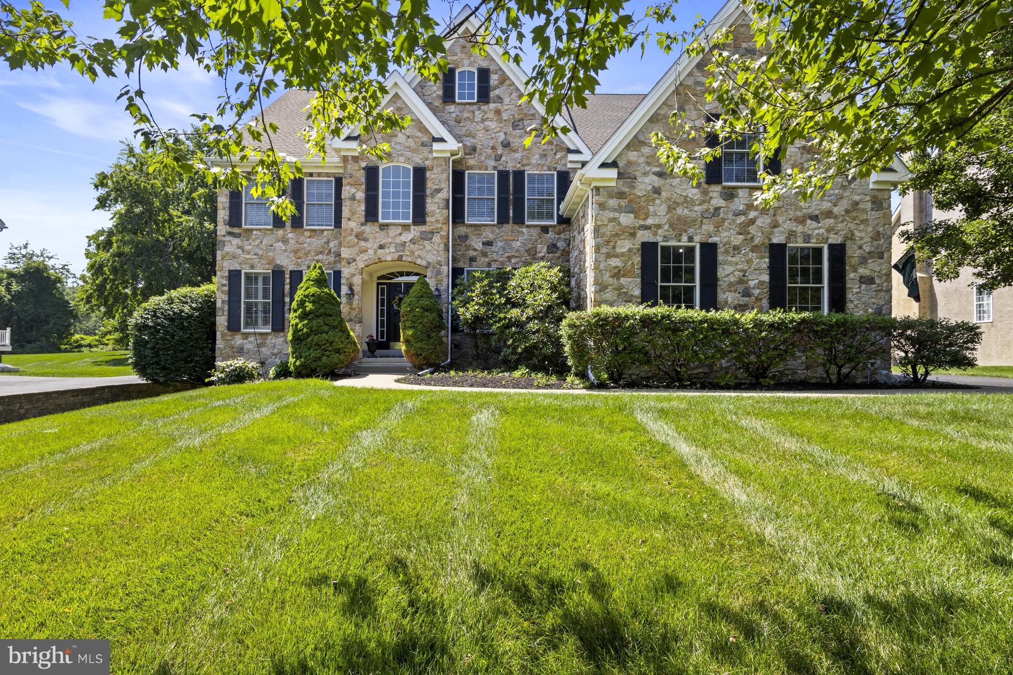 This stunning and lovingly maintained home is set on a quiet cul-de-sac in the desirable Bayard Estates neighborhood in Kennett Square. This exceptional 4BR, 3.1 bath residence has been thoughtfully updated offering an extraordinary combination of luxury, craftsmanship, and design. Enter into the elegant two-story foyer with statement turned staircase To the right is a private in-home office through French doors. To the left is a formal living room that leads into a formal dining room - perfect for entertaining family and friends. The stunning gourmet kitchen features granite counters, high-end appliances, double wall ovens, island with seating and breakfast area. The kitchen overlooks the 2-story family room with gas fireplace, large paladian windows and back staircase. A powder room, laundry room and access to the attached 3-car garage complete the main level. The second level is highlighted by an impressive primary suite offering large bedroom, an adjoining sitting room, a spacious walk-in closet, and a beautiful spa-inspired bath featuring soaking tub, frameless glass walk-in shower and dual vanities. Three additional bedrooms, one with private en-suite and the other  2 sharing a Jack-and-Jill bath, complete the upper level. The finished lower level, enhanced with numerous windows for an abundance of sunlight, provides exceptional additional living space including a media room and game room. The unfinished section offers plenty of storage space. Head out the kitchen door to the sprawling TimberTech deck overlooking the private flat yard.  
The interior showcases exceptional craftsmanship and updates with hardwood flooring, classic moldings, plantation shutters, newer roof and newer HVAC. Combining outstanding quality, thoughtful upgrades, exceptional outdoor living spaces, and a premier Bayard Estates setting, this remarkable property offers a rare opportunity to own one of the community's most distinctive homes.