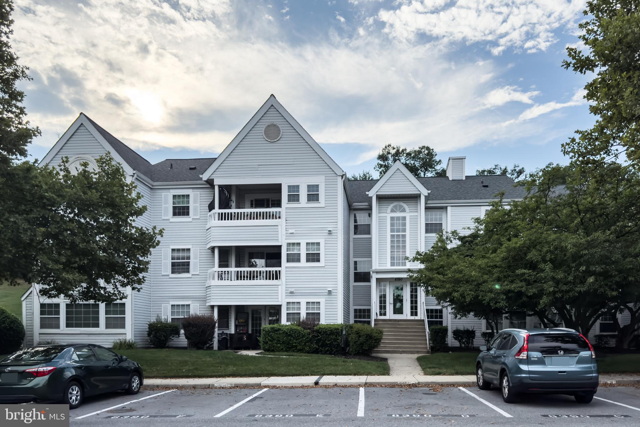 Enjoy effortless one-level living on the second floor of the highly sought-after Village of Montgomery Run condo community! Freshly painted throughout, this spacious 3-bedroom, 2-bathroom home features new luxury vinyl tile (LVT) flooring and beautifully updated kitchen and bathrooms. The galley kitchen boasts gorgeous granite countertops, sleek black and stainless steel appliances, and freshly painted designer wood cabinetry. Off the kitchen, a separate dining room flows into the bright and airy living room. Rest easy knowing a new HVAC system was installed in November 2020. Relax in total privacy on your personal deck, which directly faces a peaceful backdrop of mature trees and green space. Excellent community amenities include an outdoor swimming pool, tot lot, and walking/jogging paths—all covered by your condo fees. Complete with an assigned parking space (#8390E). Welcome home!