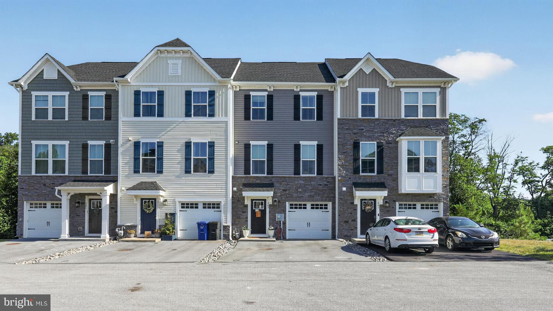 *Open House on Saturday, July 11th & Sunday, July 12th 11AM-1PM!* 
Welcome to 265 Sugar Maple Square. This lovely, like-new townhome in the Downingtown Area School District is a must see. As you enter the home, notice the expansive 1st floor living area that includes a coat closet, powder room, utility closet with additional storage and a finished recreation room with durable vinyl tile flooring. Walk outside through the glass sliding doors to enjoy the quaint backyard. As you walk upstairs, you are welcomed by open-concept main floor living, with a spacious dining area and eat-in kitchen. Enjoy meals with family and friends at the expansive kitchen island with granite countertops. The kitchen includes modern white cabinetry, stainless steel appliances, a gas oven/range, and a spacious pantry. Make your way into the living room that is complete with a powder room attached. Enjoy the beautiful spring weather on your private, full-size deck complete with Trex material and white railings. On the 3rd floor, find three bedrooms and convenient 3rd-floor laundry. The owner's suite offers a grand bedroom, walk-in closet, dual-sink vanity and a glass walk-in shower. Two additional bedrooms are paired with an additional full bathroom with soaking tub. An attached 1-car garage provides additional parking and storage opportunities. Rest easy with an outdoor Ring security camera. Upgrades throughout the home include luxury vinyl plank flooring in the entryway, 2nd floor and 3rd floor, 1st floor powder room addition, vinyl tile basement (2022), upgraded white cabinetry in the kitchen and 3rd floor bathrooms, outdoor vented range hood, full size Trex deck, a high-efficiency HVAC system with Nest thermostat, recessed lighting, a custom basement door (2024) and new stair carpeting (2026). Enjoy the private but convenient location, just a short drive from the Downingtown or West Chester Boroughs, Whole Foods Market in Exton or the King of Prussia Mall. Schedule your appointment today!