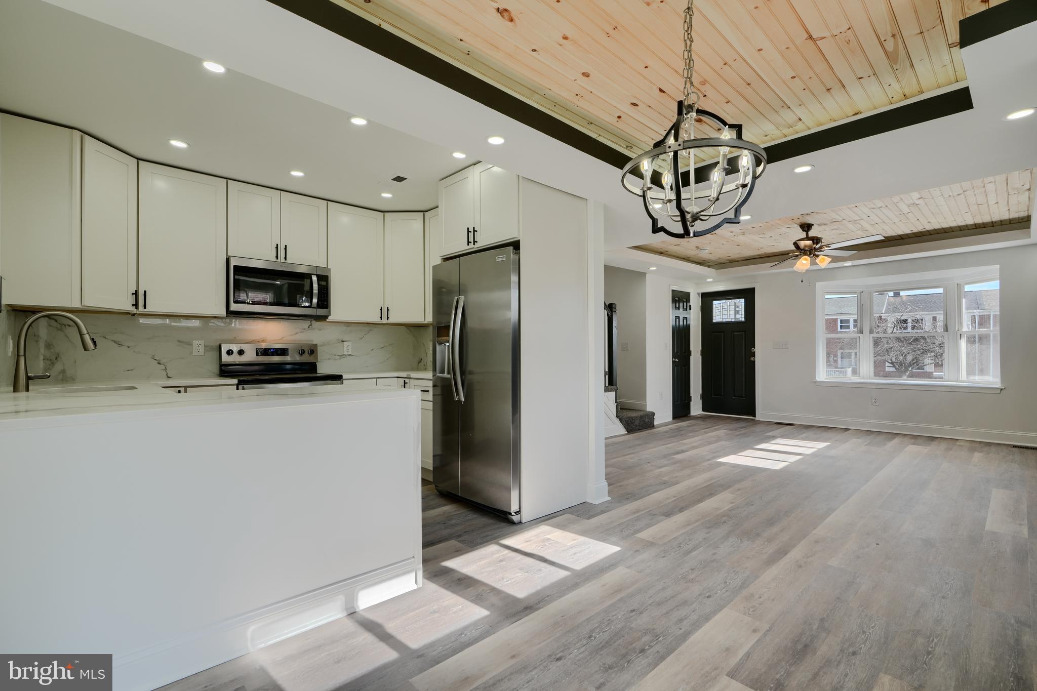 Welcome to 9722 Matzon Road in Middle River, MD! This stunning, one-of-a-kind home has been beautifully renovated with modern finishes throughout. Featuring a spacious garage, extended driveway, and a charming deck with an awning, this property is designed for both comfort and convenience.

Step inside to an inviting open-concept layout with luxury vinyl plank flooring, a stylish tray ceiling with recessed lighting, and a striking wooden-paneled ceiling that adds warmth and character. The gourmet kitchen is perfect for cooking and entertaining, with direct access to the large backyard—ideal for gatherings and outdoor enjoyment. A convenient powder room completes the main level.

Upstairs, you'll find three bedrooms and a luxurious bathroom designed for relaxation. The fully finished basement offers additional living space, including a rec room, laundry area, a versatile bedroom/office, and a full bathroom.

This home is truly a must-see! Schedule your showing today and experience the perfect blend of modern style and functionality.