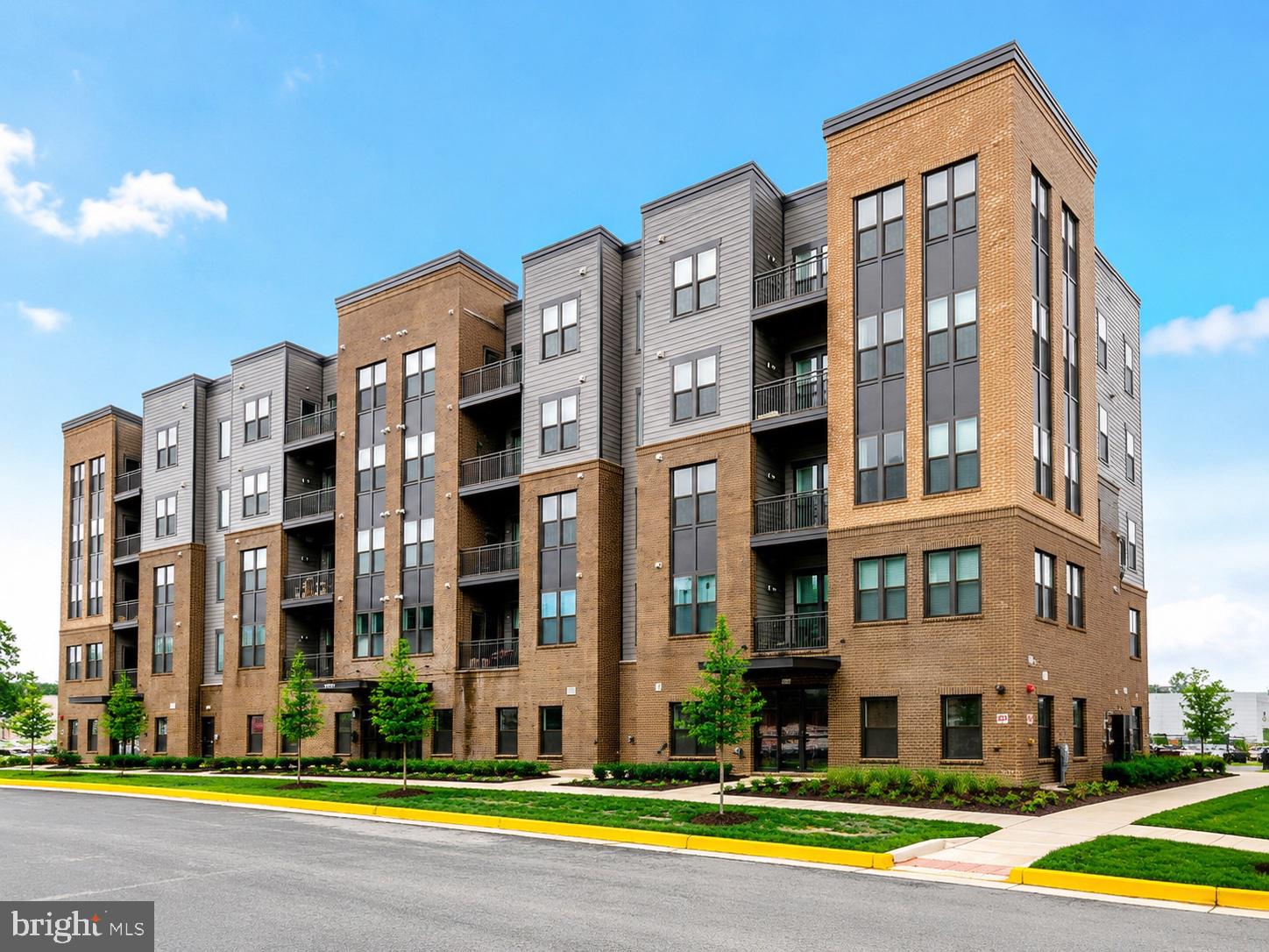 Seller is relocating and motivated to sell! Priced below the original purchase price and the seller is willing to help the buyer with closing costs! Experience upscale, low-maintenance living in this nearly brand-new condominium at The Residence at Waxpool Crossing — ideally located just a mile from the Silver Line Metro, major commuter routes, shopping, dining, parks, and everything Ashburn has to offer. Built in 2024 and delivered in 2025, this beautifully designed residence offers the benefits of nearly brand-new construction without the wait, delays, or builder premiums. Located on the 4th floor of a 5-story building, this 2-bedroom, 2-bath condo with a versatile den/office features a bright open-concept layout filled with natural light, creating the perfect balance of comfort, style, and functionality. The modern kitchen opens seamlessly to the spacious living and dining areas, making everyday living and entertaining effortless. The flexible den provides the ideal space for a home office, separate dining room, or workout room — perfect for today’s lifestyle.
The spacious primary suite offers a peaceful retreat with a large walk-in closet and a beautifully appointed en-suite bath. Enjoy the convenience of elevator access, secure building entry, garage parking space (#16), a large storage bin (#9), and a true lock-and-leave lifestyle in one of Ashburn’s most desirable locations. Rare opportunity to own one of the community’s most desirable floor plans, priced under $500K in the heart of Ashburn. Also, a great investment opportunity with rental potential of $2,800+/month. Beautifully maintained and move-in ready!
