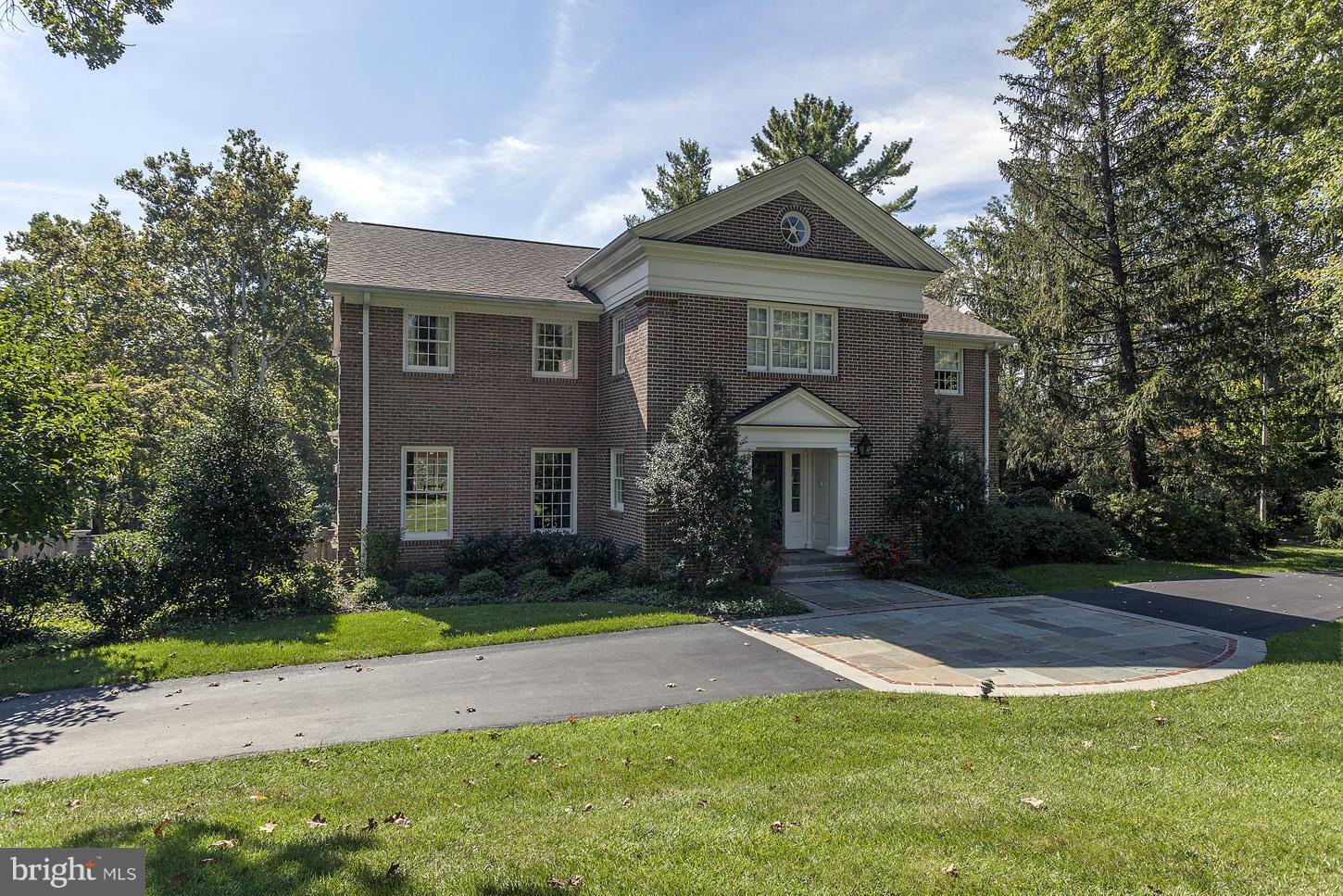 Traditional brick Colonial in friendly cul-de-sac neighborhood near Tysons & GW Parkway. Custom architectural details add character and charm. Kitchen opens to family room, sunroom and veranda overlooking spacious backyard with pool & terrace. Upper level has five bedrooms, including a master suite with dressing room & bath. Walk-out lower level with oversize 2-car garage and ample storage space.