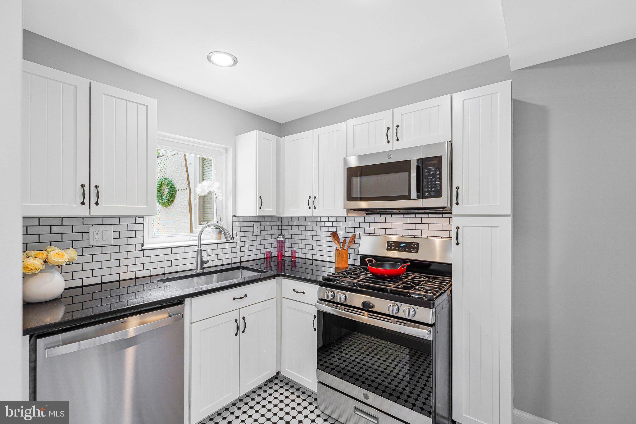 Treasured & Stunning 3 level, 2 bedrooms, 1 bath townhome.  Freshly painted throughout (2026), refinished hardwoods (2026), new GE dishwasher (2026), dual pane - double hung windows, recessed lights throughout (2026) & fence freshly painted (2026).
The inviting white picket fence greets everyone with a smile as they wave hello or stop in for a chat! 
The light & airy main level enhances your senses from the sun’s rays glistening along the hardwoods as you enter the living room. Showcase treasures on the dining area’s built-in or floating shelves against the brick accent wall. Mouthwatering creations entice the senses from the gas range to the wrap around granite countertop.
The alluring refinished hardwood stairs (2026) lead the way to private bedroom areas. Primary suites warm embrace with tree views offers space for a reading area or Pilates. Second bedroom delights with reading nook & tree views. Luxurious windowed bath shines with tub/shower tiled to ceiling, shower head & wand.
Lower-level family room is an ideal bonus area for video games, board games, reading, play area, and the options are boundless. Laundry, additional storage & new flooring (2026) complete the lower level. 
The patio provides entertainment under the twinkle lights around the firepit or BBQ, slate walkway, herb garden, adjacent shed all within the freshly painted privacy fence (2026). Step through the back gate to seamless alley parking! 
Seamless access to Ballston Metro, public transit, D.C., Reagan National Airport, GW Pkwy, I-66, Georgetown, Museums, Monuments, Pentagon, Amazon HQ2, Livin’ The Pie Life, Metro 29 Diner, Cherrydale, Lee Heights Shops, parks, trails, bike paths, entertainment & eateries!