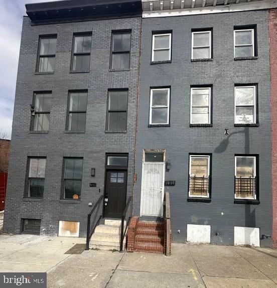 BACK ON THE MARKET for the SAVVY home purchaser or investor. PLEASE BE A READY, WILLING AND ABLE BUYER. TITLE COMPANY NEEDS TO KNOW & UNDERSTAND THE SHORT SALE  PROCESS AND HOW TO CLOSE A SHORT SALE.  AMAZING OPPORTUNITY & WIN for the new buyer ESPECIALLY considering that 1032 W. Franklin Street, right next door, sold on 1/16/2026 for $370,000.00. But, this home does not fall short of finely designed finishes.  Three levels have been revamped with today's upgrades. Featuring fresh paint, upscale kitchen and bathroom finishes, recessed lighting, double-door, stainless steel refrigerator & plenty of cabinet space. Ease of washing and drying clothes as washing machine and dryer are located on 2nd floor bedroom level.  Third floor has its own private suite that can be used as a lounge, office space or extra storage and has its own bathroom.  Located within minutes of popular city attractions such as the Edgar Allan Poe home & museum as well as all the fun and liveliness of the Inner Harbor and other downtown activities. Multiple down payment assistance programs may help buyers to further qualify for loan programs. This community may qualify for the $20,000 renovation grant and $15,000 Buy Back the Block down payment assistance grant for qualified buyers. SHORT SALE. QUICK RESPONSE FROM THE LENDER.