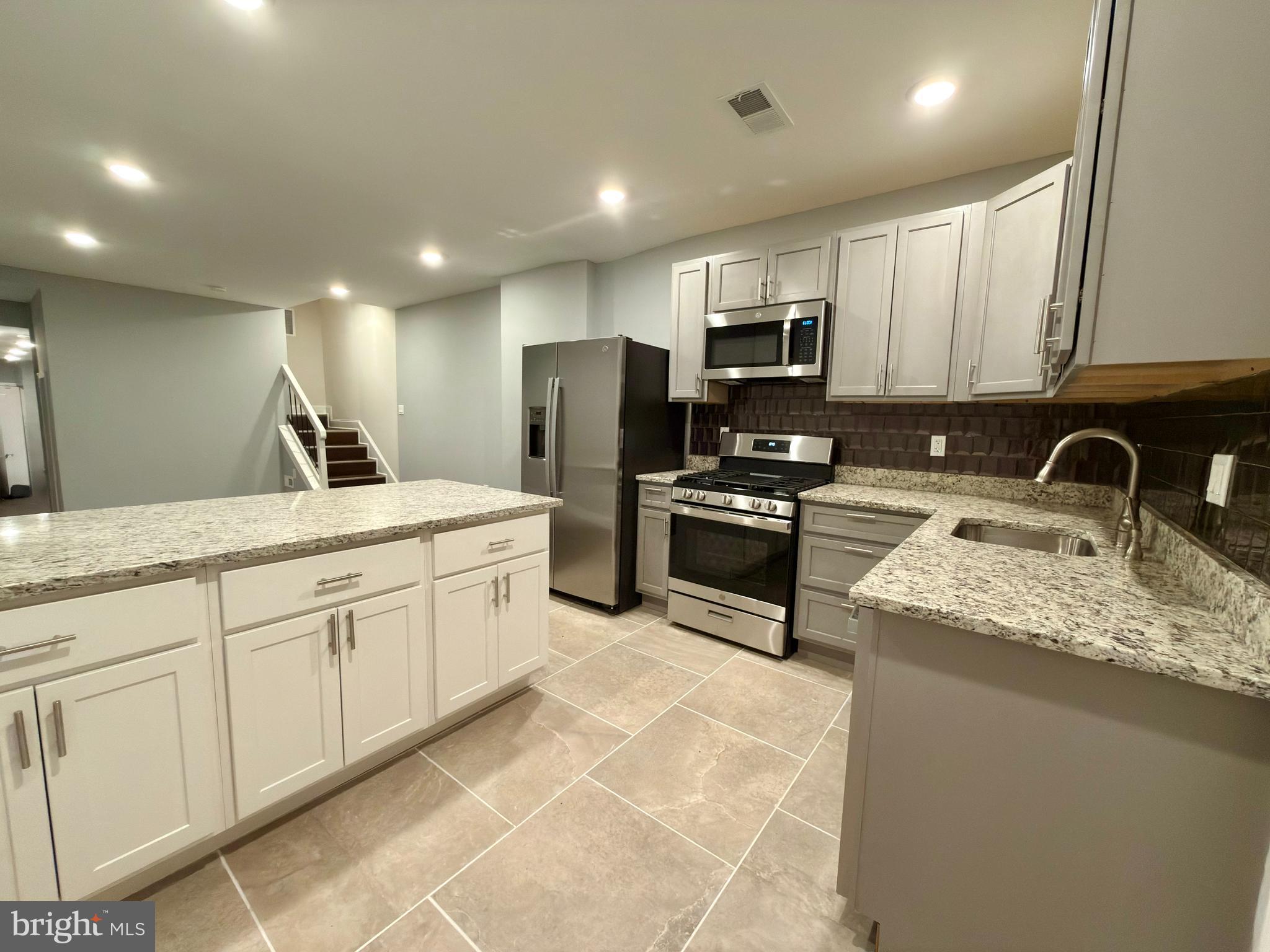 Fully renovated townhome in Baltimore featuring 3 bedrooms, 2 full baths, and 1 half bath. This move-in-ready home offers a fresh, modern interior with brand-new appliances, updated kitchens and baths, and stylish finishes throughout. Bright and open floor plan ideal for comfortable living and entertaining. Conveniently located near major commuter routes. A great opportunity to own a turnkey home in the city—schedule your showing today.