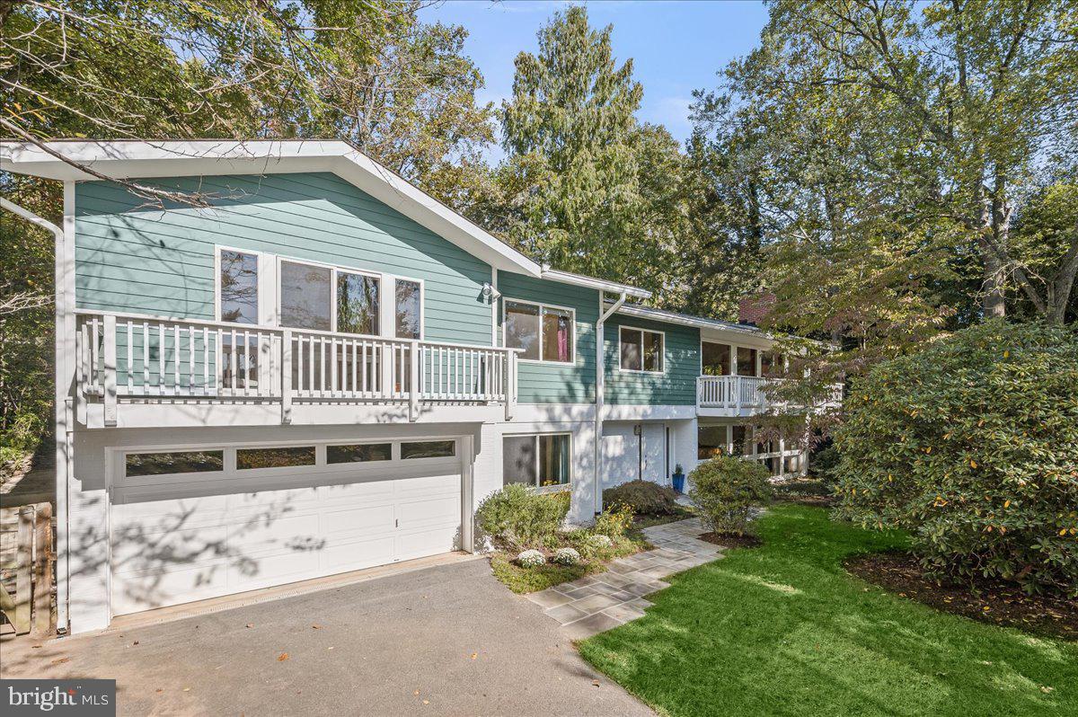 Exquisitely renovated and expanded mid-century modern home in Carderock Springs! This Valley View model has it all—stunning entertaining spaces inside and out, rarely available 4 super-large bedrooms and baths, and lovely flexible layout for family living and entertaining! All with beautiful tree-top views and great privacy. Magical garden and screened porch….Premium, level and private  lot in the heart of the neighborhood! Walk to school, park, playground, pool, tennis and more!

This enchanting home has all the hallmarks of the Carderock homes--wonderful integration into the landscape, walls of glass, vaulted ceilings and open spaces, globe lights, floating staircase and more. The renovations have created wonderful  open spaces as well as providing rarely available extra large king and queen sized bedrooms and expansive bathrooms plus a dedicated office space!  The entire main  living space   has a vaulted ceiling, the living room with fireplace and Ipe balcony is open to the large dining room which opens to the renovated kitchen with warm wood cabinets, Kraus workstation sink, quartz countertops. Both the kitchen and dining room have wall-length sliding glass doors giving onto the expansive screened porch (large enough for sitting and dining areas). The porch overlooks the delightful fish pond with diverse flowering plants. Huge play space and great privacy in the garden. The bedroom wing has a spacious king-sized primary suite with second Ipe balcony, walk-in closet and huge  renovated primary bath with double floating vanity, soaking tub, extra large shower and heated tile floors. 2 additional queen sized bedrooms and an open office and a double-sized renovated hall bath (two sinks, deep tub/shower and heated towel rack and floors.  The entry level has  an oversized family room and  bedroom both overlooking the delightful front garden, a full bath (making this an ideal in-law suite option), laundry room/utility/storage plus an additional storage room and mudroom leading to the two car garage. The home has been fully upgraded including double paned windows and new roof in 2023! 

Carderock/Pyle/Whitman cluster! Carderock has a wonderful pool /tennis/ pickleball/basketball/playground at the clubhouse (also an architectural gem) and walking trails. An active community with many community events for all ages. Conveniently located to all the major employment centers (DC, Bethesda, No VA, 270 corridor) and steps to parks, trails, C and O Canal, Great Falls and more! Minutes to Cabin John with it's restaurants and deli.